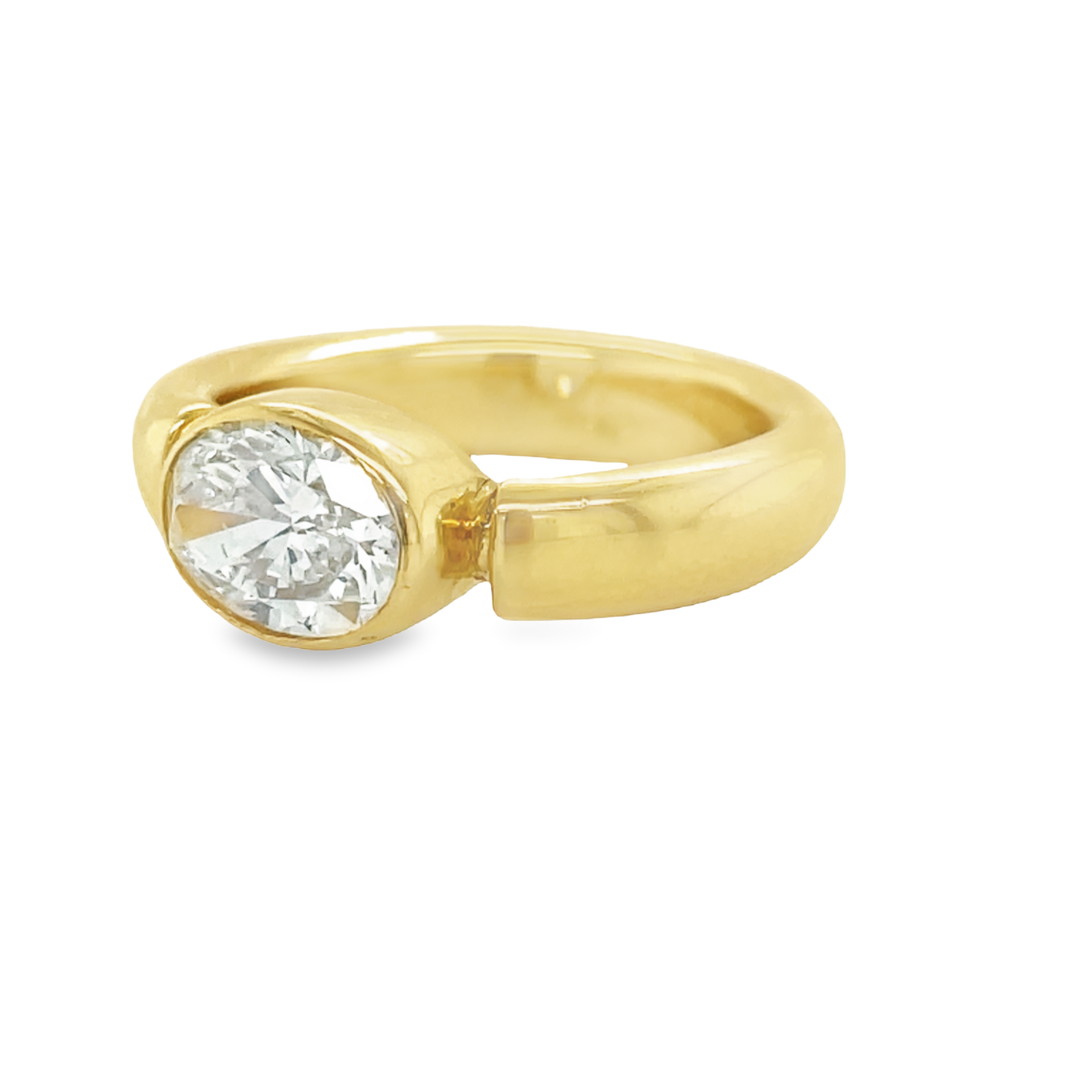 A modern take on the classic engagement ring, this custom design showcases a GIA certified 1.051 ct Oval Cut diamond set east-west in a contemporary 18k gold bezel setting. With a SI1 Clarity and Color H rating, you can be sure this diamond is top quality. Plus, the comfortable fit band ensures all-day comfort.