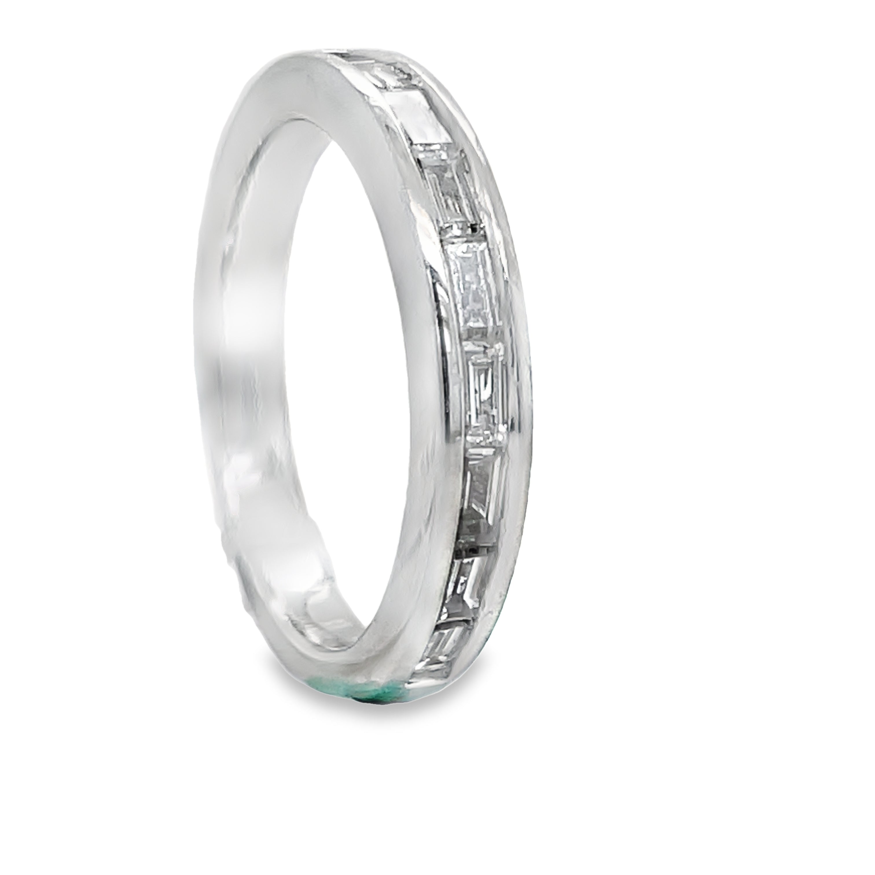 This stunning anniversary band features a channel set of sparkling baguette diamonds totaling 0.62 cts. Made of platinum, this band is both elegant and durable. Perfect for celebrating milestone anniversaries and adding a touch of luxury to any outfit.