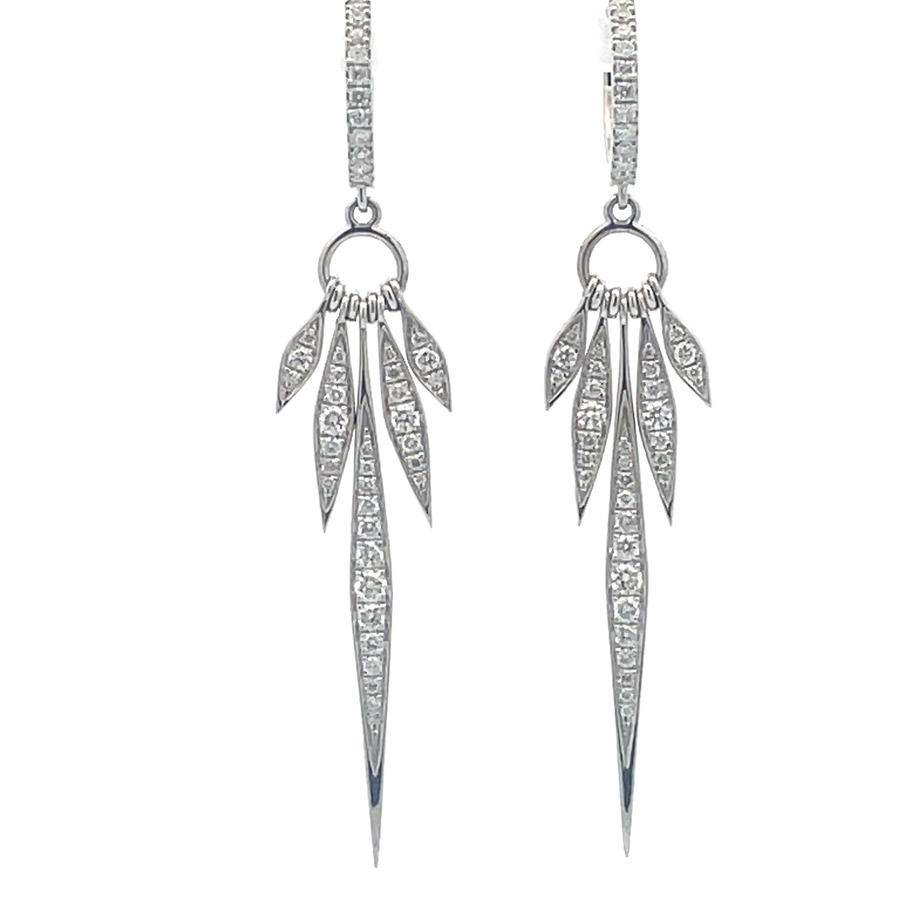 Enhance your edgy style with our Five Spike Diamond Earrings. Crafted from 18k white gold, these long earrings feature 5 multi-size spikes adorned with round diamonds totaling 0.82 cts. With an easy hinge system, these earrings provide both style and convenience. Elevate any look with these unique and stunning earrings.