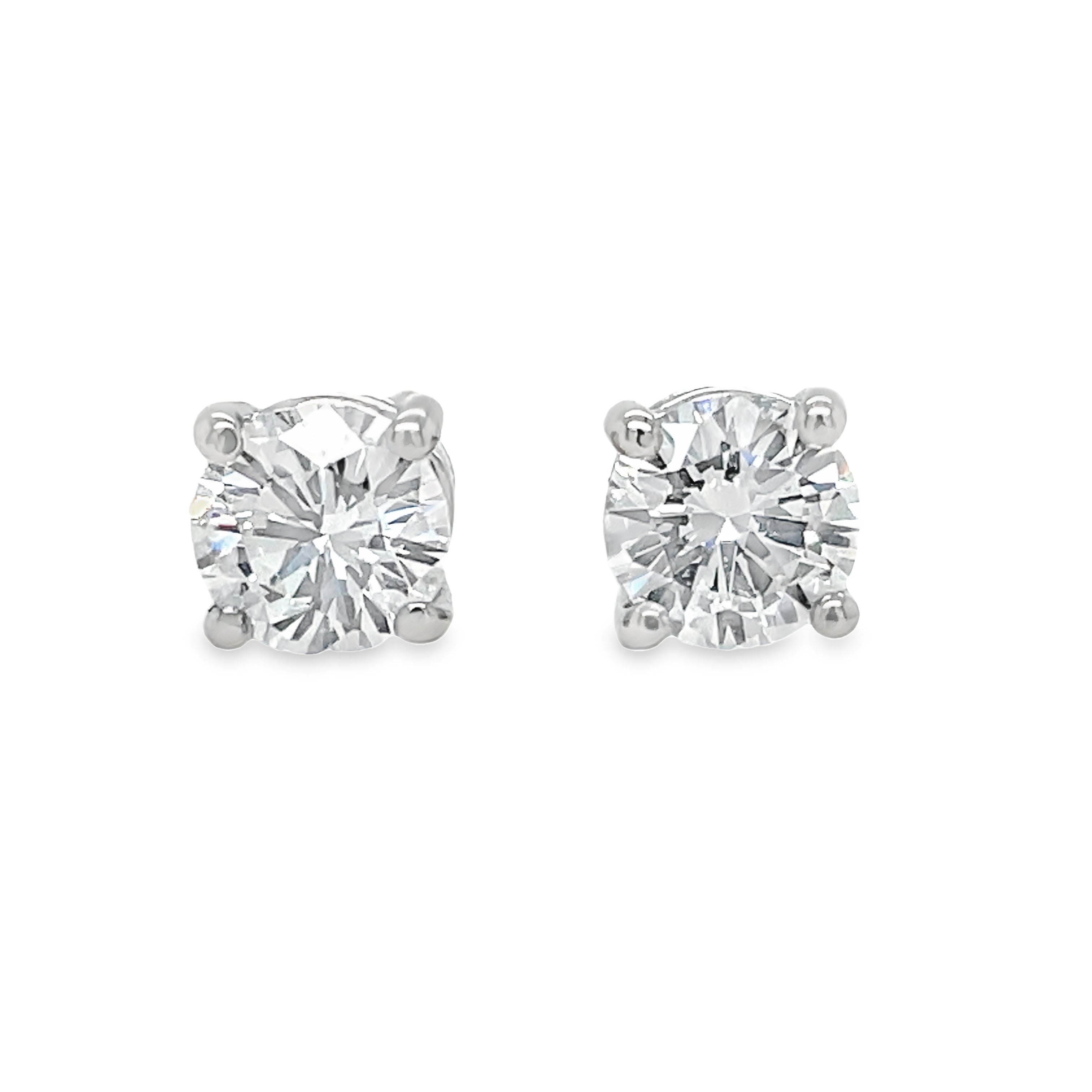 Elevate your style with our exquisite Diamond Stud Earrings! Crafted with two round brilliant diamonds, basket set in sleek 14k white gold, these earrings exude timeless elegance. Showcasing H color and VVS clarity, they're the perfect addition to any jewelry collection. Order now and shine bright like a diamond!
