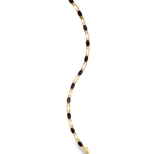 Top view of Estate 14k Yellow Gold Garnet and Diamond Line Bracelet