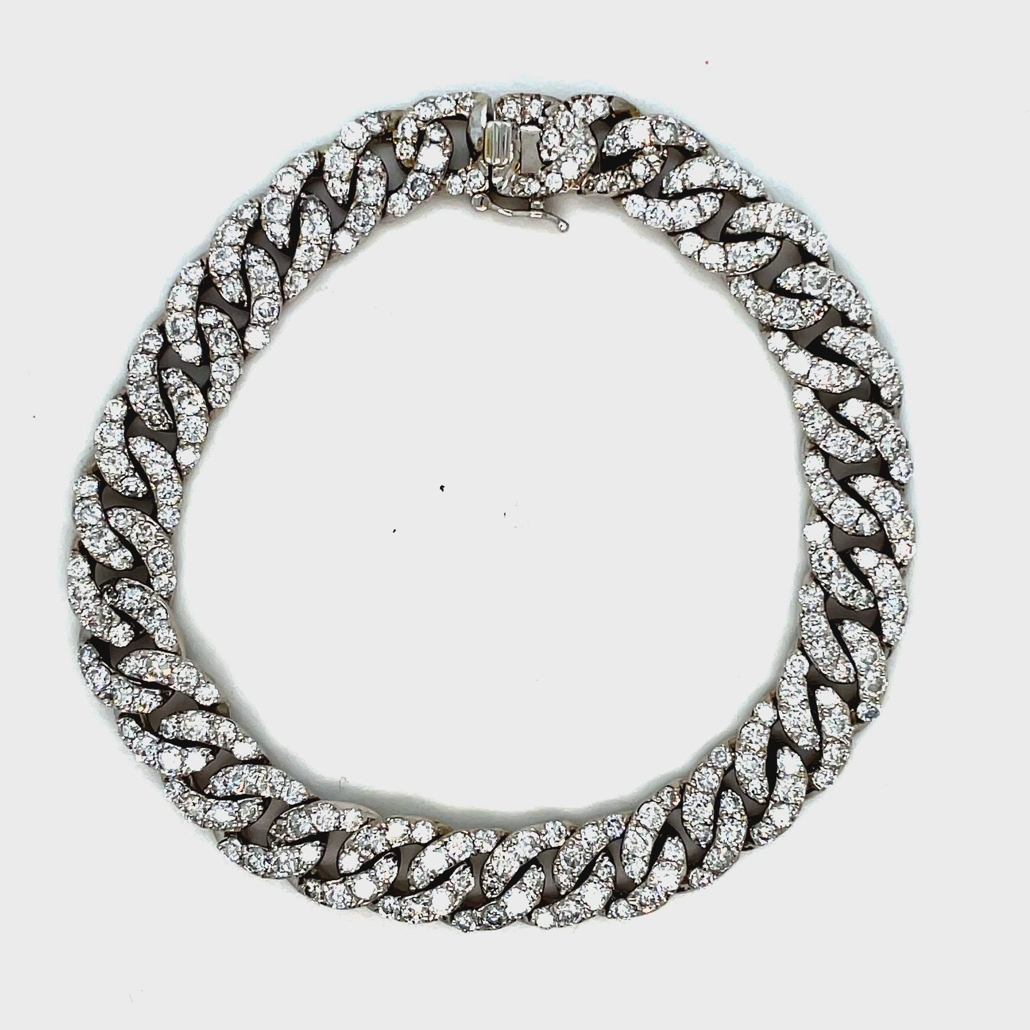 This 18k white gold chain link diamond bracelet features 7.58 carats of round diamonds for sparkle and shine. The bracelet is 7 1/4" long and features a hidden clasp for security and a classic curb link design.