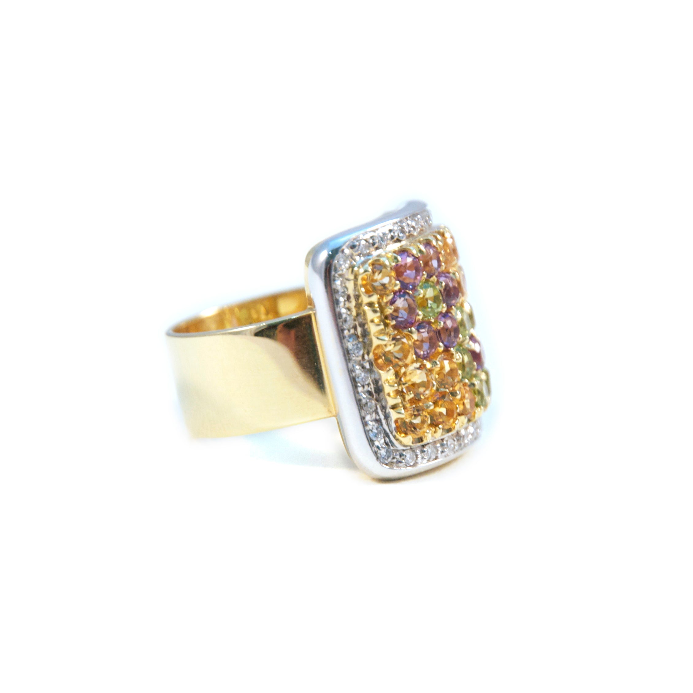 A timeless design, crafted with Pascale Bruni's signature blend of elegance and luxury. This dazzling ring features an 18k two-tone gold band set with 0.32 cts of round diamonds that sparkle alongside the deep purple amethyst and warm yellow citrine stones.