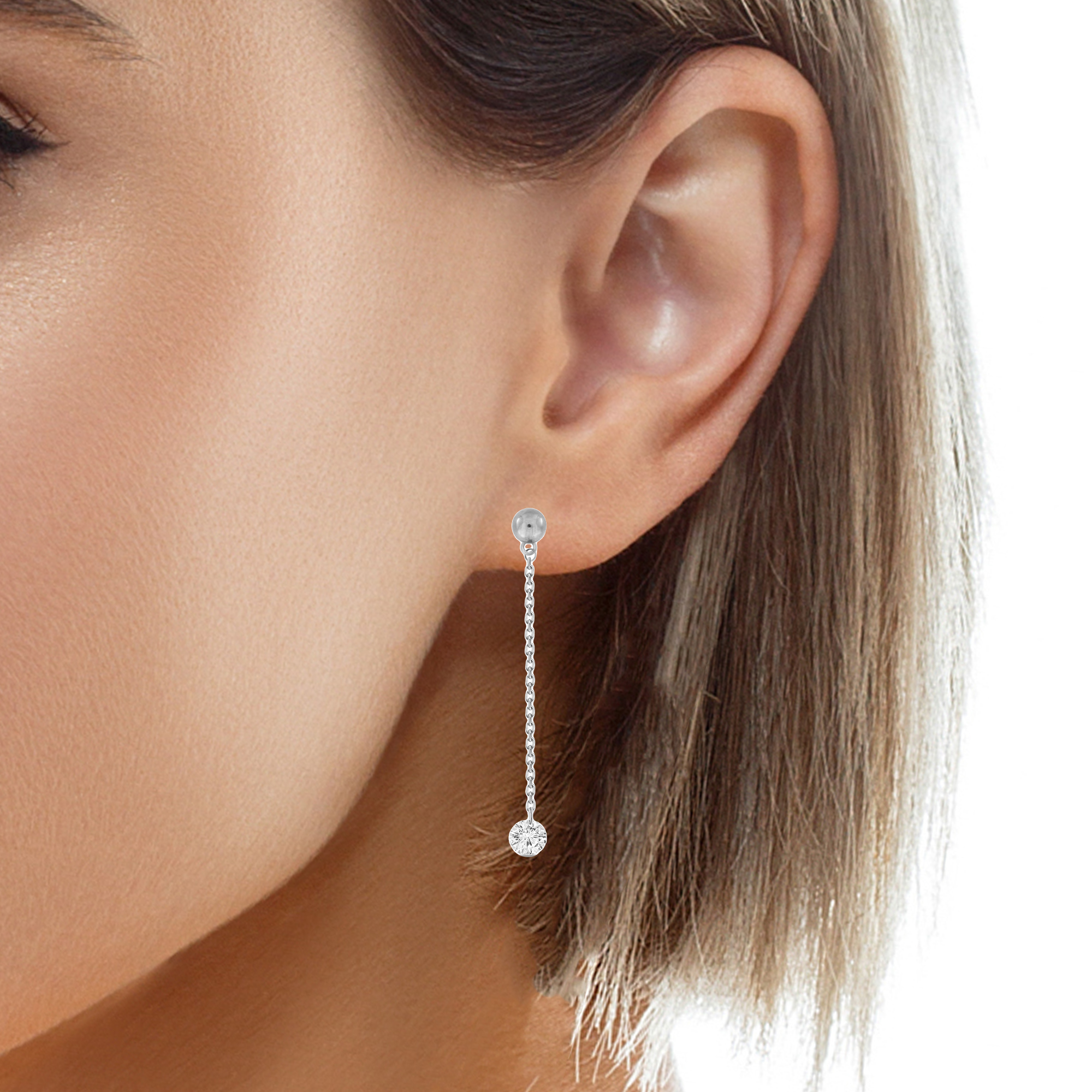These diamonds float and dance, captivating in their intricate motion. Crafted in shimmering 18k white gold, they hold 0.34 cts of brilliant round diamonds. Held securely by a secure friction back, these earrings reach a length of 1.5" and are the perfect adornment for any occasion.