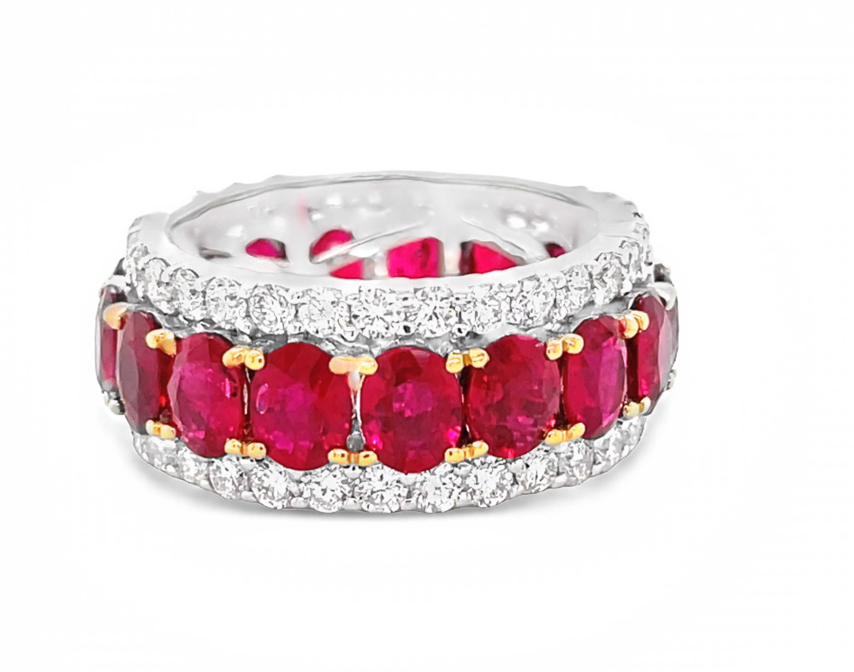 18k white & yellow gold ring  Oval shape Rubies 6.11 cts  Round diamonds 1.89 cts.  Eternity band   9.00 mm.  Size 6