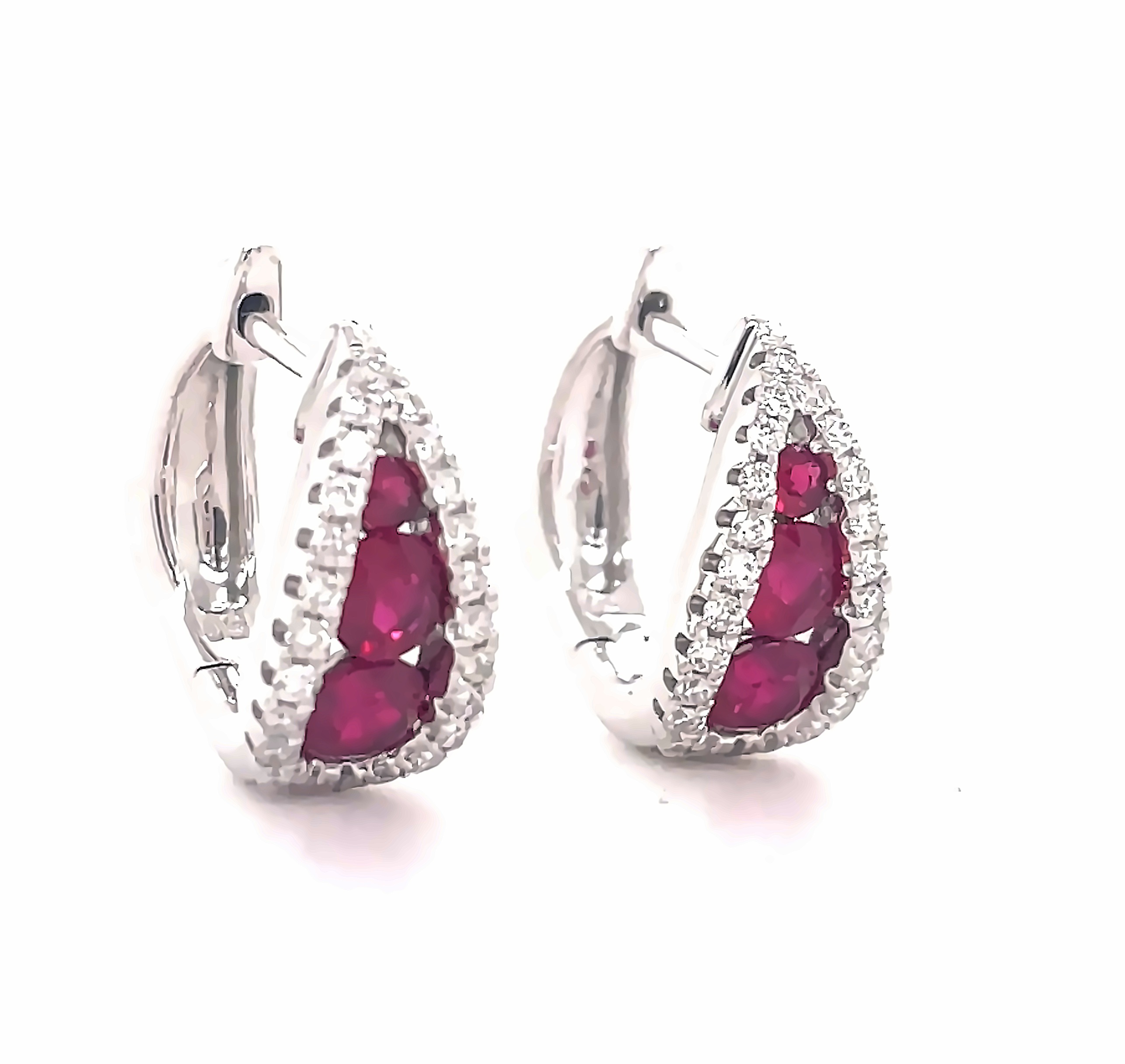 Everyday diamond hoop earrings.   18k white gold  Modern style.  Secure hinge system  Round diamonds 0.90 cts  Three graduated rubies 0.71 cts  F/G color  13.00 x 14.00 mm long.