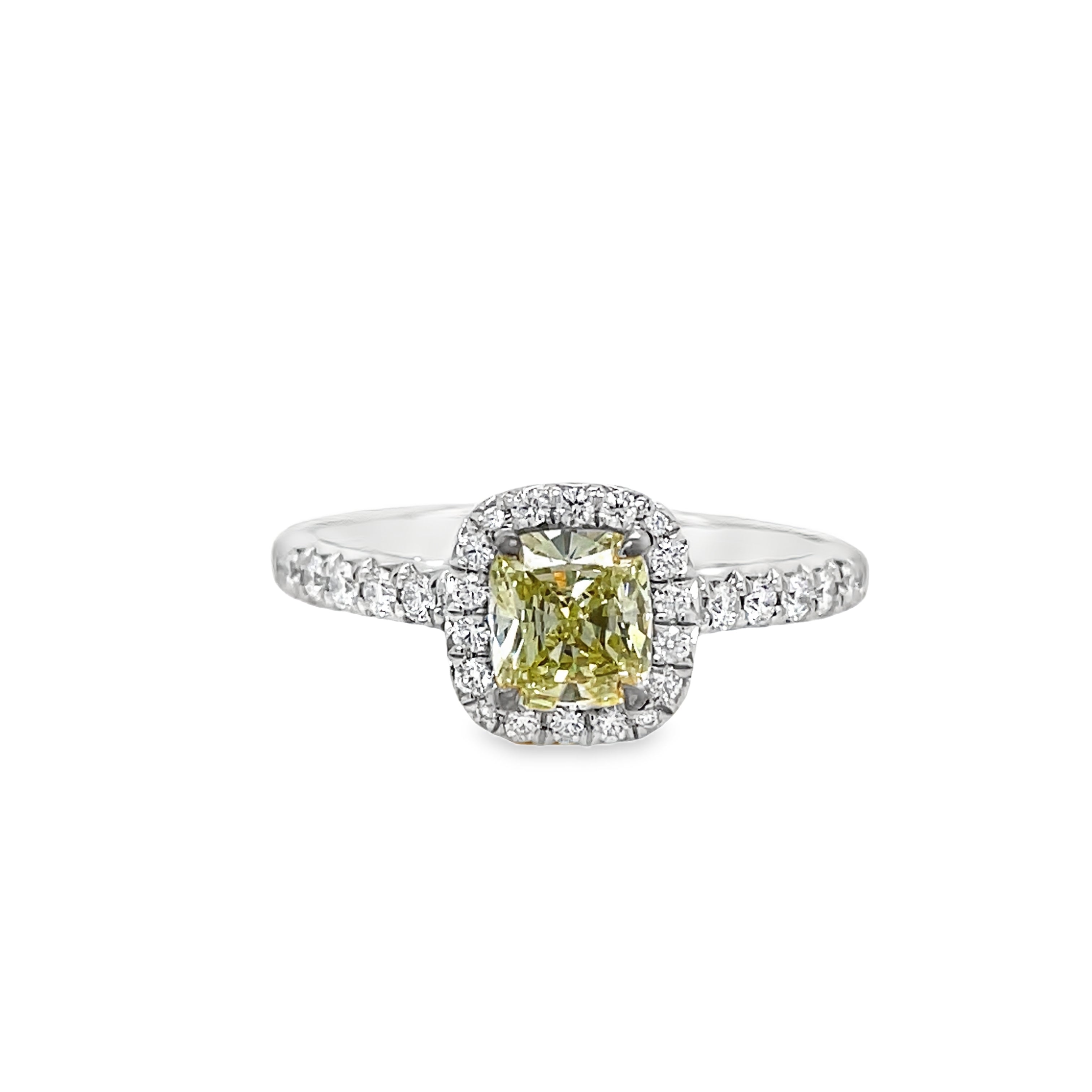 ntroducing our exquisite Estate Tiffany and Co. Fancy Yellow Diamond and Round Diamond Engagement Ring. Crafted with platinum and boasting a stunning 0.72 ct fancy yellow diamond with VS1 clarity, this ring exudes elegance and sophistication. Surrounded by 0.70 cts of sparkling round diamonds, it is a true masterpiece that will captivate any admirer. Elevate your love with this luxurious and exclusive piece.