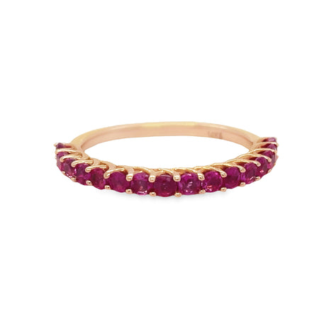 Create a timeless look with this Ruby Anniversary Band made from 14k rose gold and featuring round cut rubies totaling 0.97 cts. Its sophisticated style will last forever.