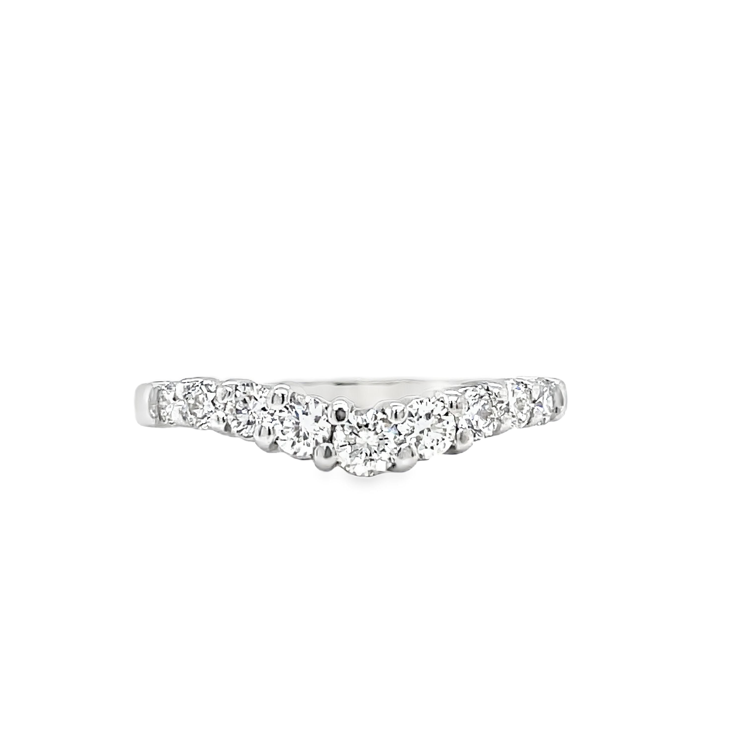 Indulge in the beauty of our Anniversary Diamond V- Shape Ring. Crafted in exquisite 14k white gold, this ring features a stunning v-shaped design adorned with sparkling round diamonds totaling 0.55 carats. With F/G color and VS1 clarity, it exudes a luxurious and exclusive aura, making it the perfect symbol of your eternal love.