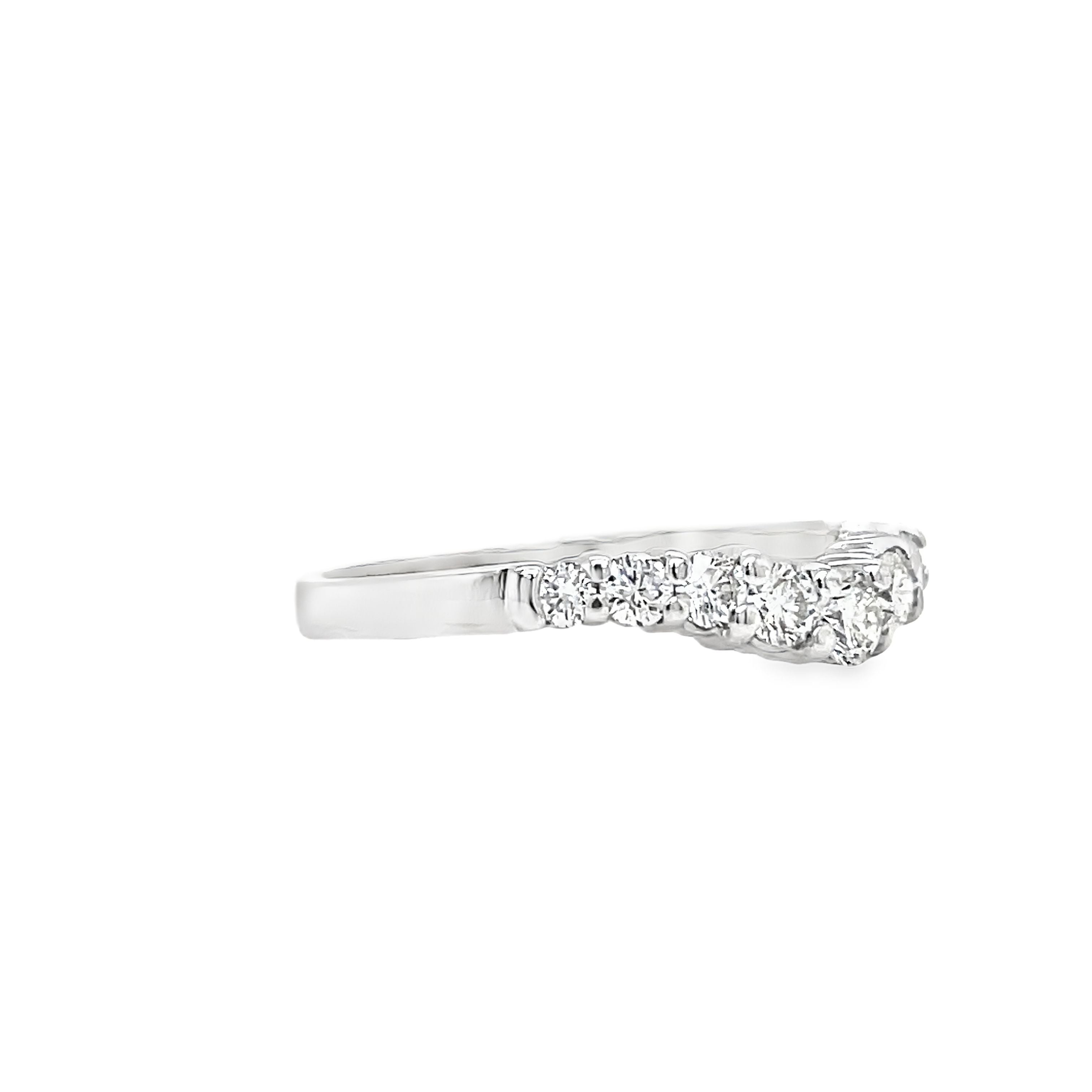 Indulge in the beauty of our Anniversary Diamond V- Shape Ring. Crafted in exquisite 14k white gold, this ring features a stunning v-shaped design adorned with sparkling round diamonds totaling 0.55 carats. With F/G color and VS1 clarity, it exudes a luxurious and exclusive aura, making it the perfect symbol of your eternal love.