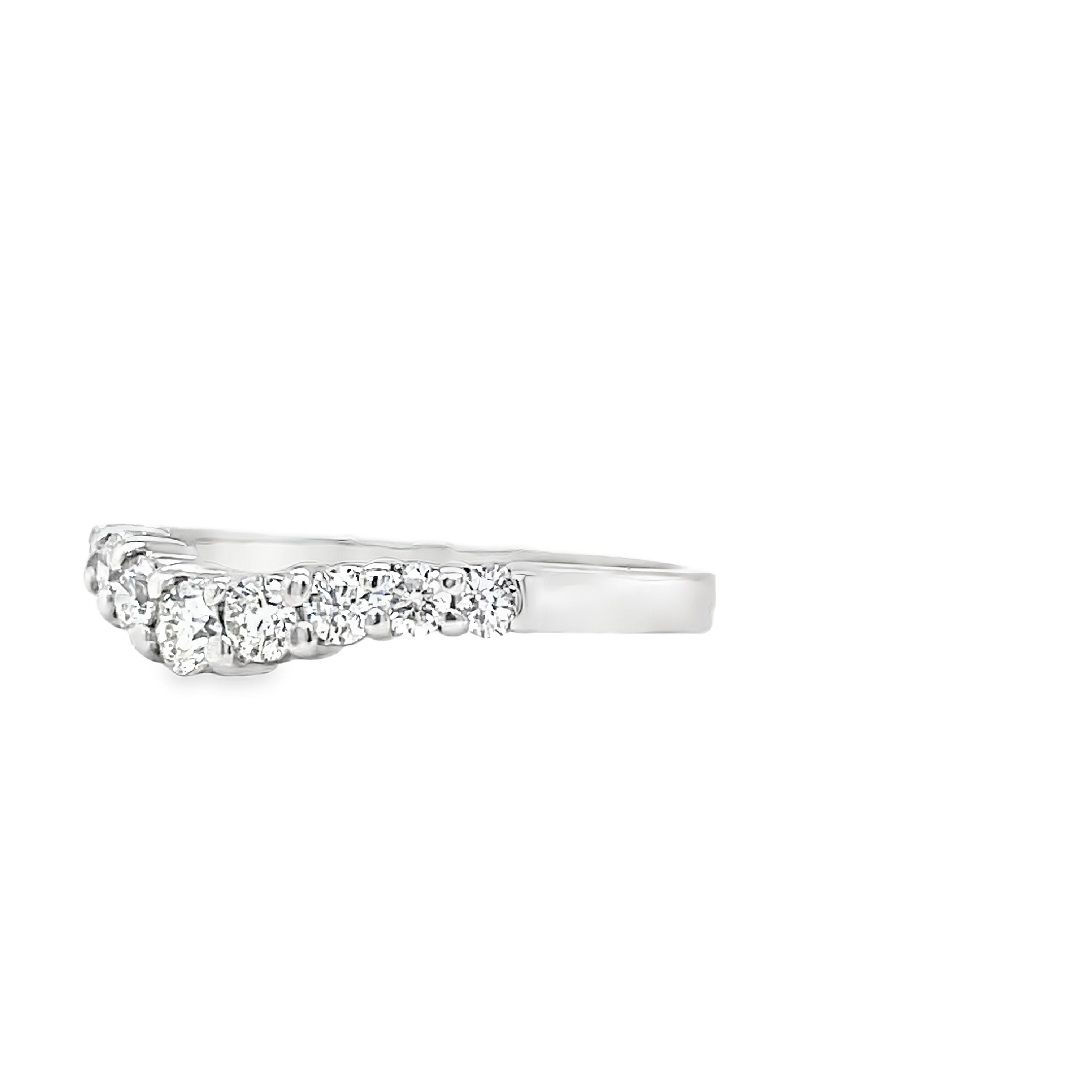 Indulge in the beauty of our Anniversary Diamond V- Shape Ring. Crafted in exquisite 14k white gold, this ring features a stunning v-shaped design adorned with sparkling round diamonds totaling 0.55 carats. With F/G color and VS1 clarity, it exudes a luxurious and exclusive aura, making it the perfect symbol of your eternal love.