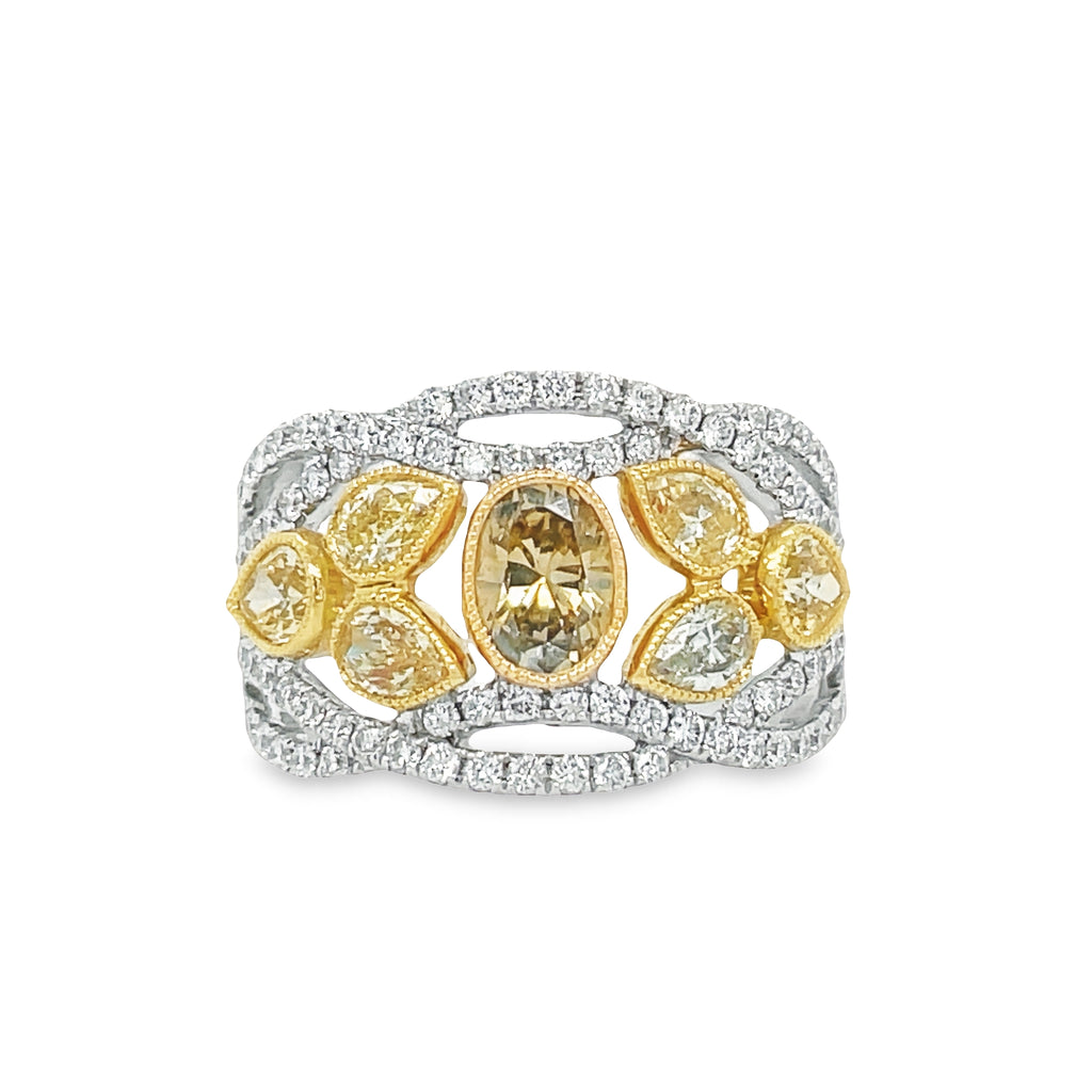 Make a statement with this stunning Champagne & Yellow Diamond Ring! With one oval champagne diamond 0.68 cts and six pear shape yellow diamonds 1.16 cts boasting round diamonds with a total carat weight of 0.69 cts you'll be sure to dazzle any room you enter. The elegant design is also set with 0.69cts of round diamonds for additional sparkle.