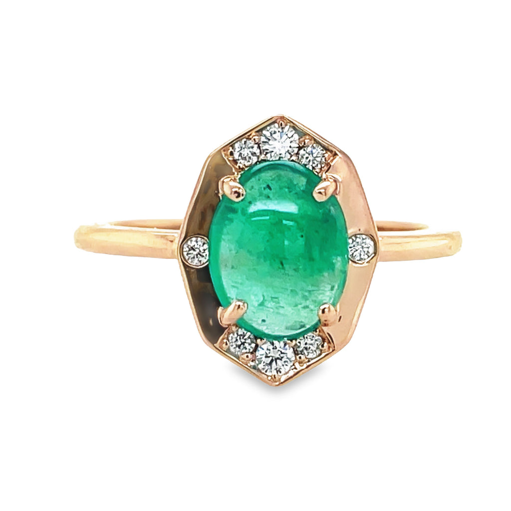 A beautiful statement piece, this 14k rose gold ring features a stunning emerald cabochon center, surrounded by round diamonds. A perfect combination of classic styling and modern elegance.