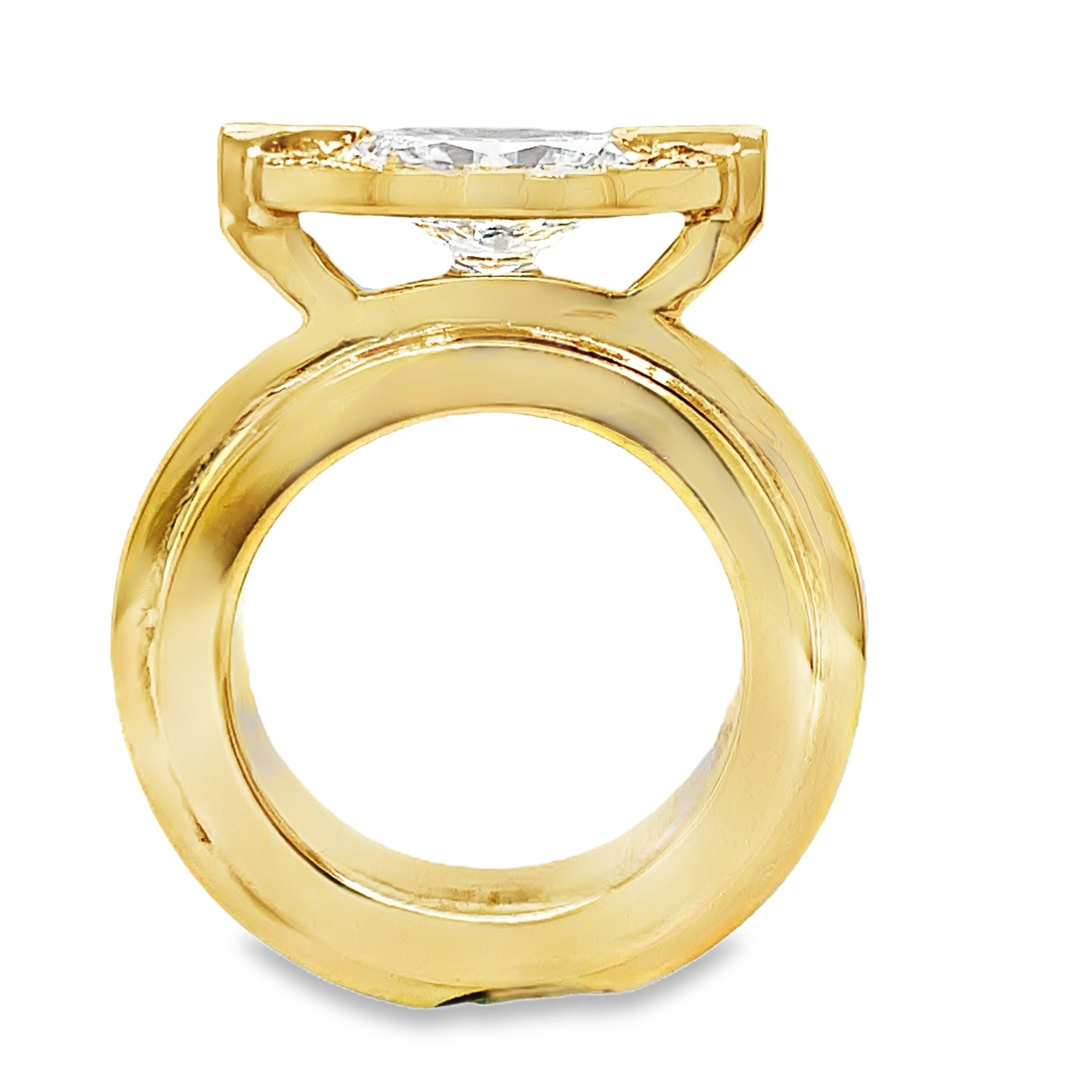 ndulge in luxury with our 18k Custom Made Diamond Staircase Ring. This stunning oval cut diamond, boasting a remarkable 2.01 carats, is set in 18k yellow gold with a handcrafted staircase gold style band. Radiate elegance with the sparkling clarity of color E, elevating any look to the next level.