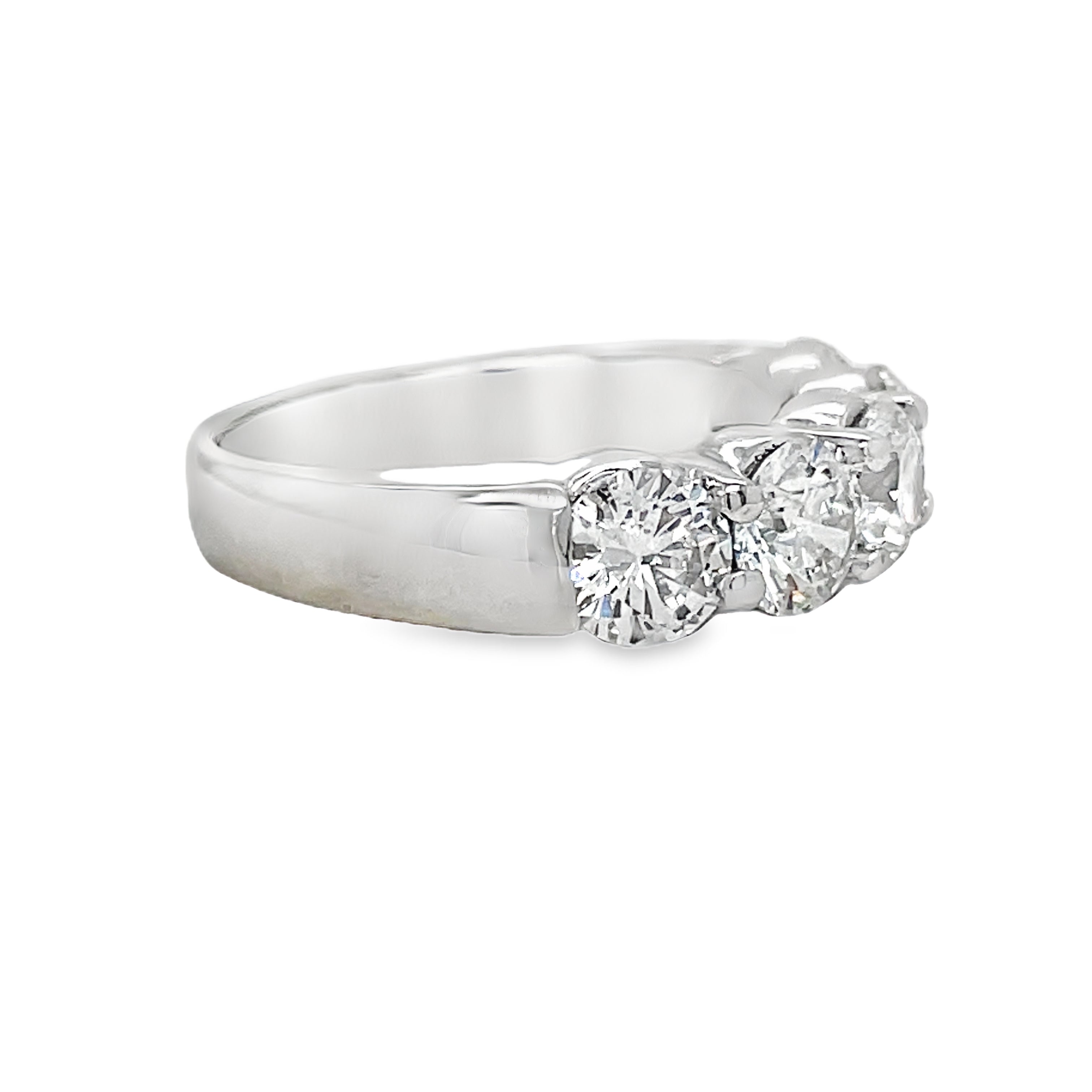 Indulge in luxury with our Five Stone Anniversary Band. The five round diamonds, totaling 2.50 cts, sparkle in a platinum prong setting. With G/H color and VS2 clarity, this band screams elegance and sophistication. Celebrate your love with this exquisite and exclusive piece.