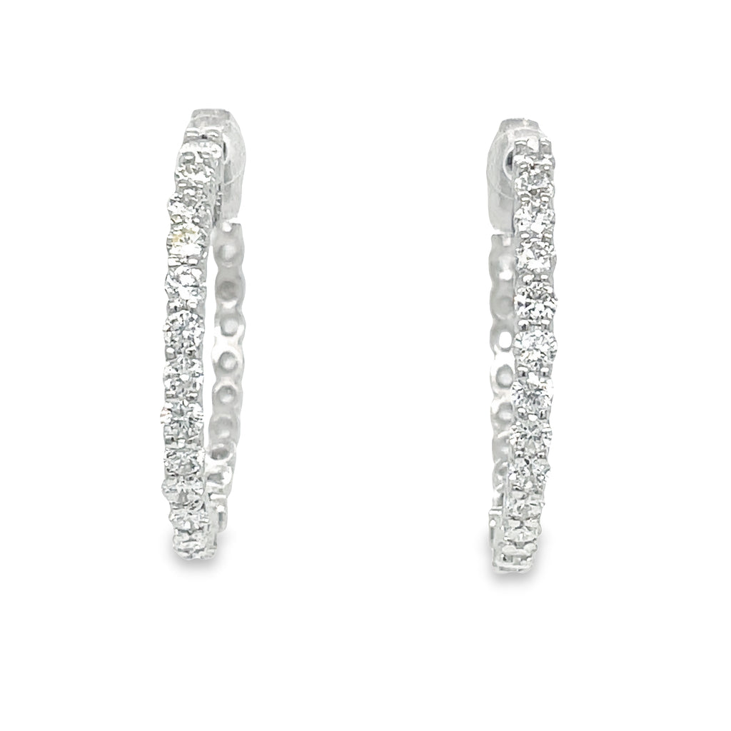 These Large Hoop Earrings feature 1.16 ct Round diamonds of F/G color and VS1 clarity. The hoops are 2.00 mm thick and 23.00 mm long, crafted from 14k white gold with a secure lock clasp. Lever back system ensures the earrings are easy to put on and take off.  