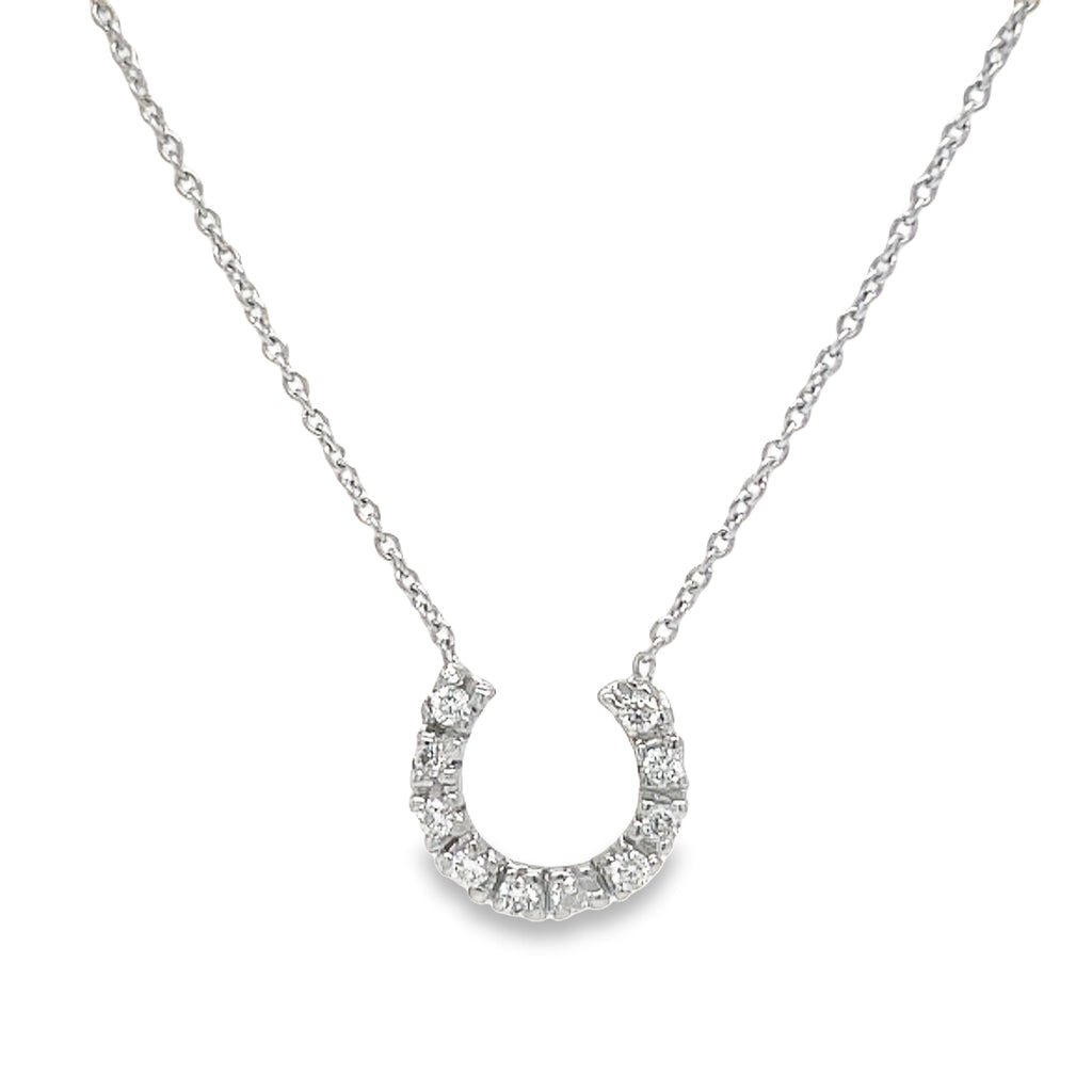 Complete your elegant look with our stunning Horse Shoe Diamond Necklace. Featuring a horse shoe pendant crafted from 14k white gold and embellished with sparkling round diamonds totaling 0.20 carats, this necklace will add a touch of glamour to any outfit. Comes with a 16" long chain for the perfect fit. Perfect for the passionate and stylish individual in you!"
