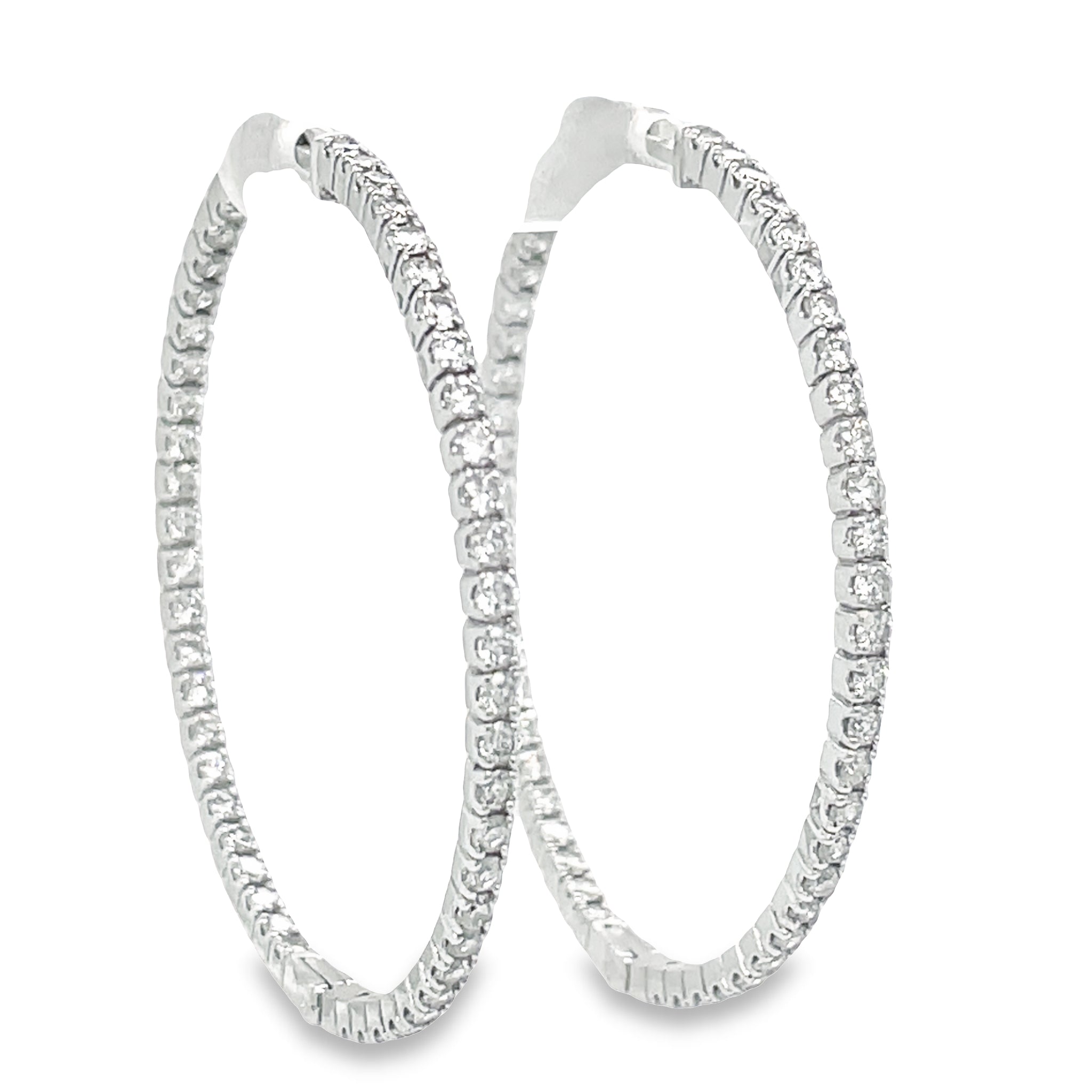 These Large Hoop Earrings feature 5.15 cts Round diamonds of F/G color and VS1 clarity. The hoops are 3.00 mm thick and 2" size, crafted from 14k yellow gold with a secure lock clasp. Lever back system ensures the earrings are easy to put on and take off.

