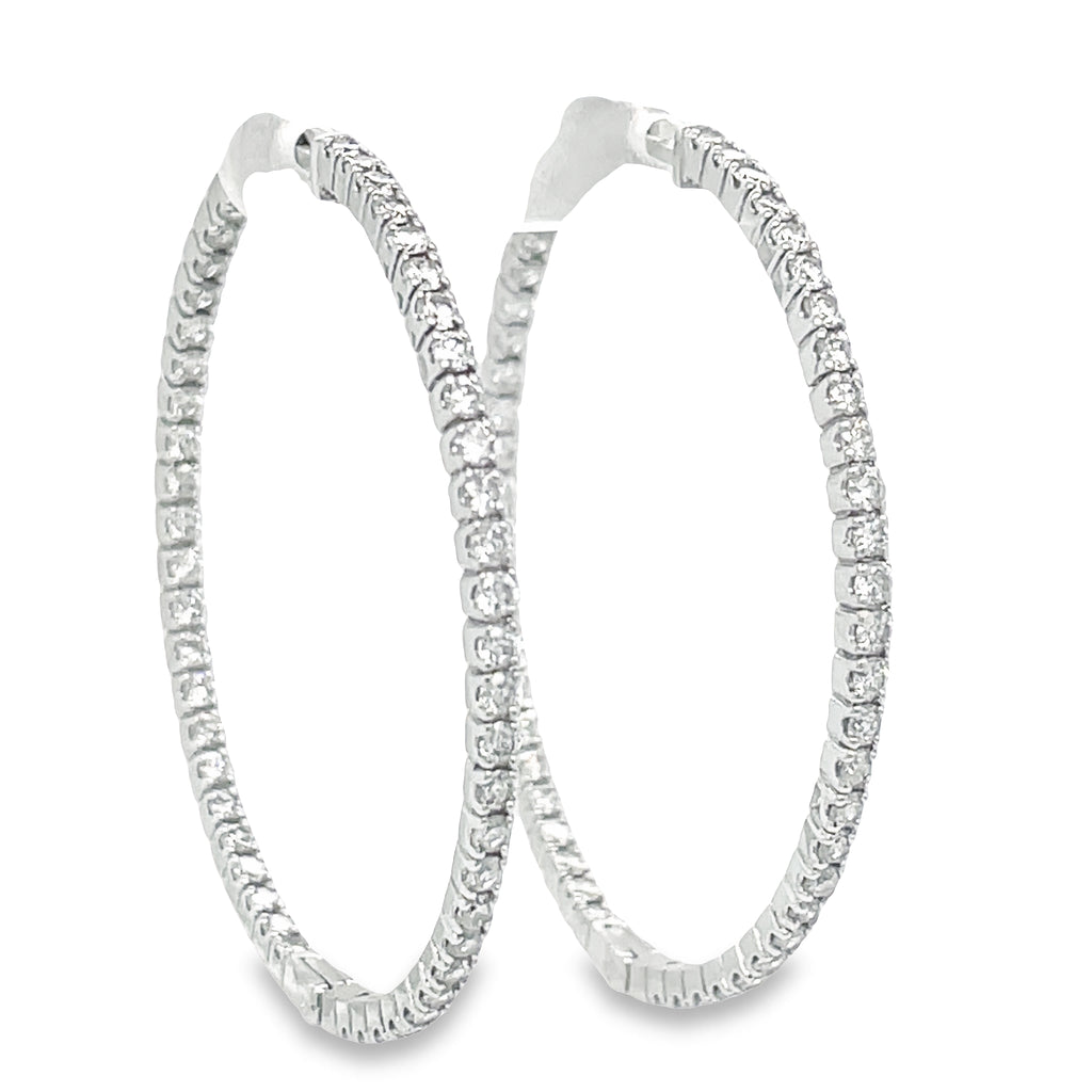These Large Hoop Earrings feature 2.20 ct Round diamonds of F/G color and VS1 clarity. The hoops are 2.00 mm thick and 33.00 mm long, crafted from 14k yellow gold with a secure lock clasp. Lever back system ensures the earrings are easy to put on and take off.  