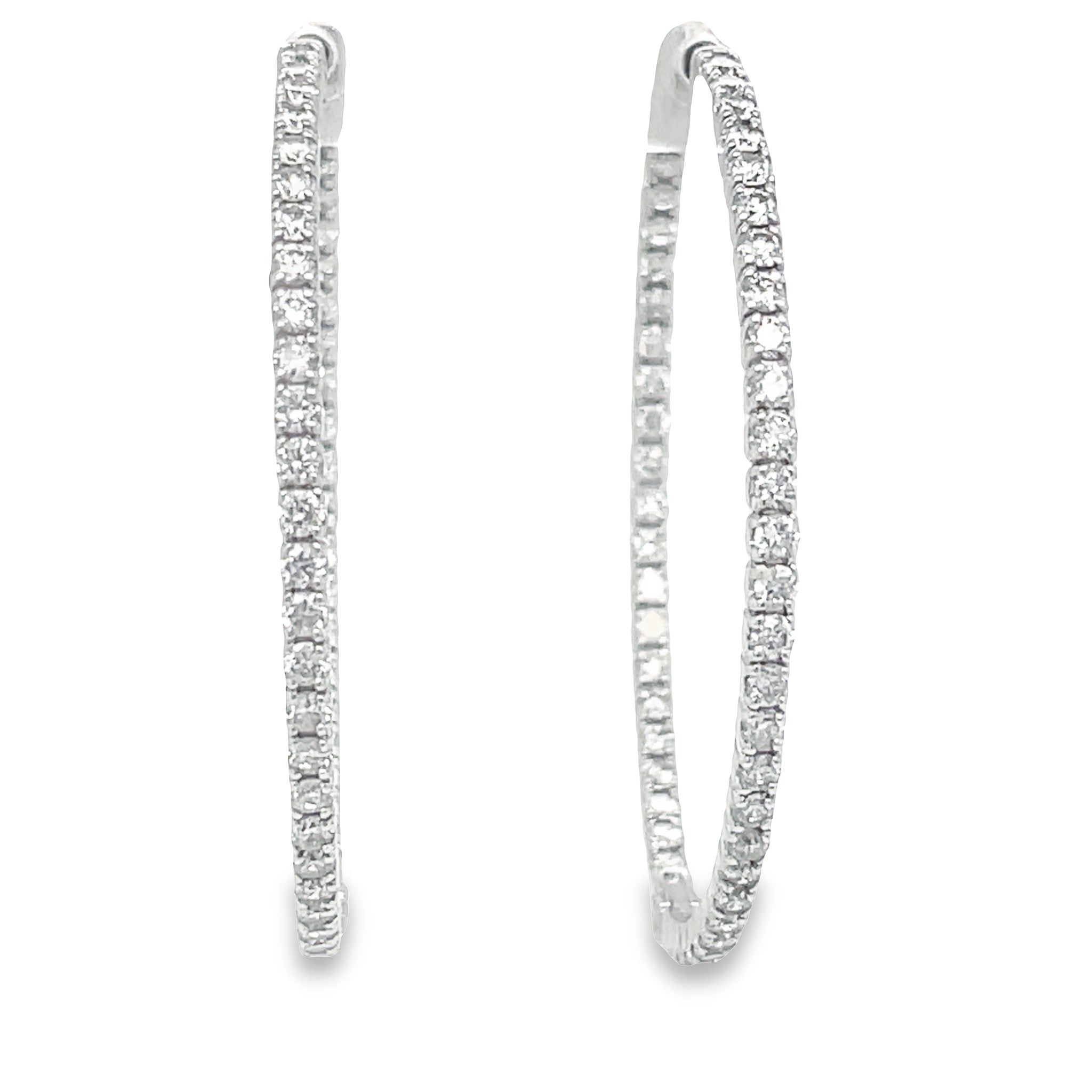 These Large Hoop Earrings feature 5.15 cts Round diamonds of F/G color and VS1 clarity. The hoops are 3.00 mm thick and 2" size, crafted from 14k yellow gold with a secure lock clasp. Lever back system ensures the earrings are easy to put on and take off.

