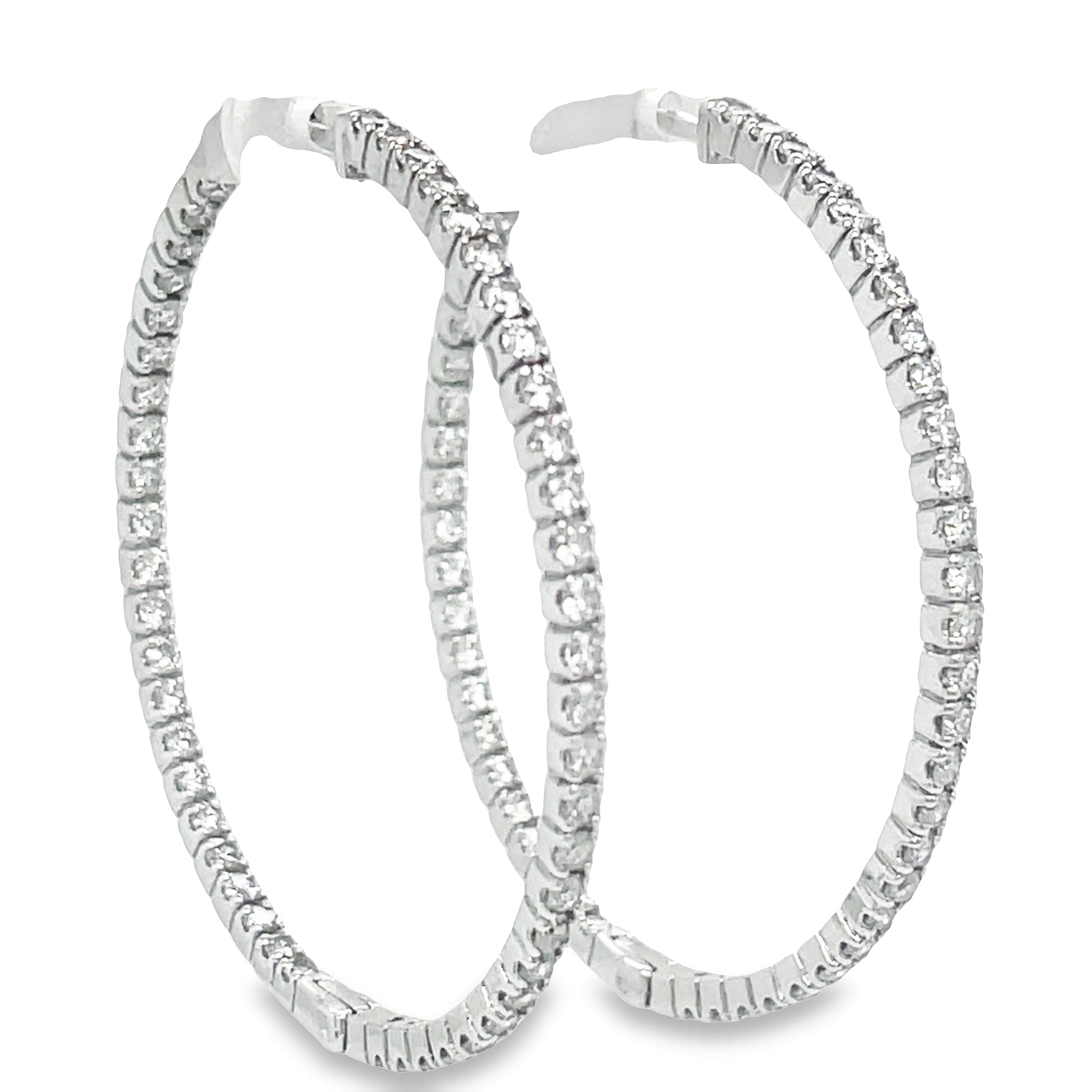 TThese Large Hoop Earrings feature 5.15 cts Round diamonds of F/G color and VS1 clarity. The hoops are 3.00 mm thick and 2" size, crafted from 14k yellow gold with a secure lock clasp. Lever back system ensures the earrings are easy to put on and take off.

