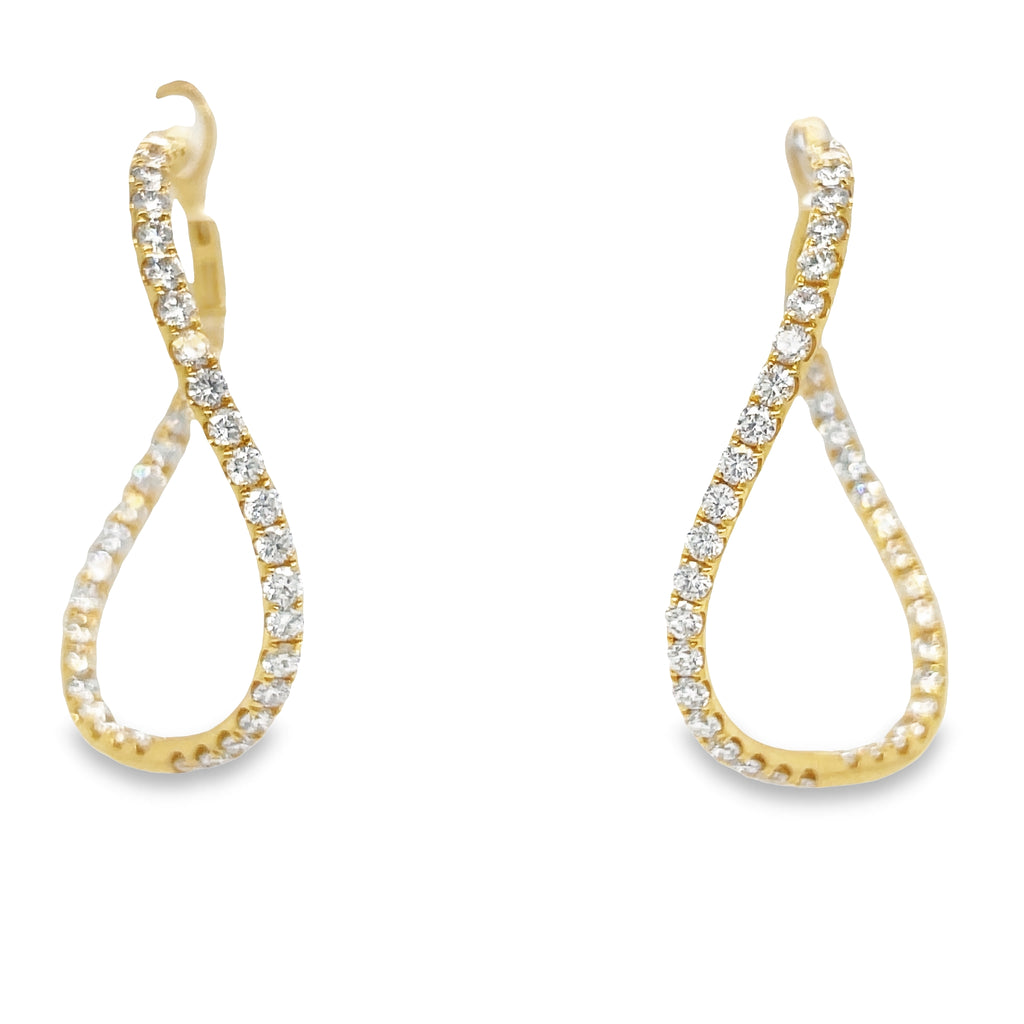 These Inside Out Diamond Twisted Hoop Earrings are expertly crafted from 18k yellow gold and feature 2.30 cts of round diamonds. The earrings measure 2.30 mm wide and are 1 1/2" long, for a timeless look that is sure to dazzle.