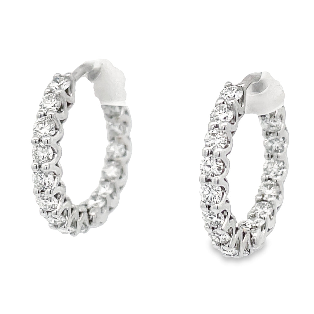 Featuring stunning 1.30 cts diamonds encased in luxurious 18k white gold, these inside-out huggie earrings are sure to draw attention. Crafted for maximum sparkle, they are the perfect accessory to effortlessly elevate your look!