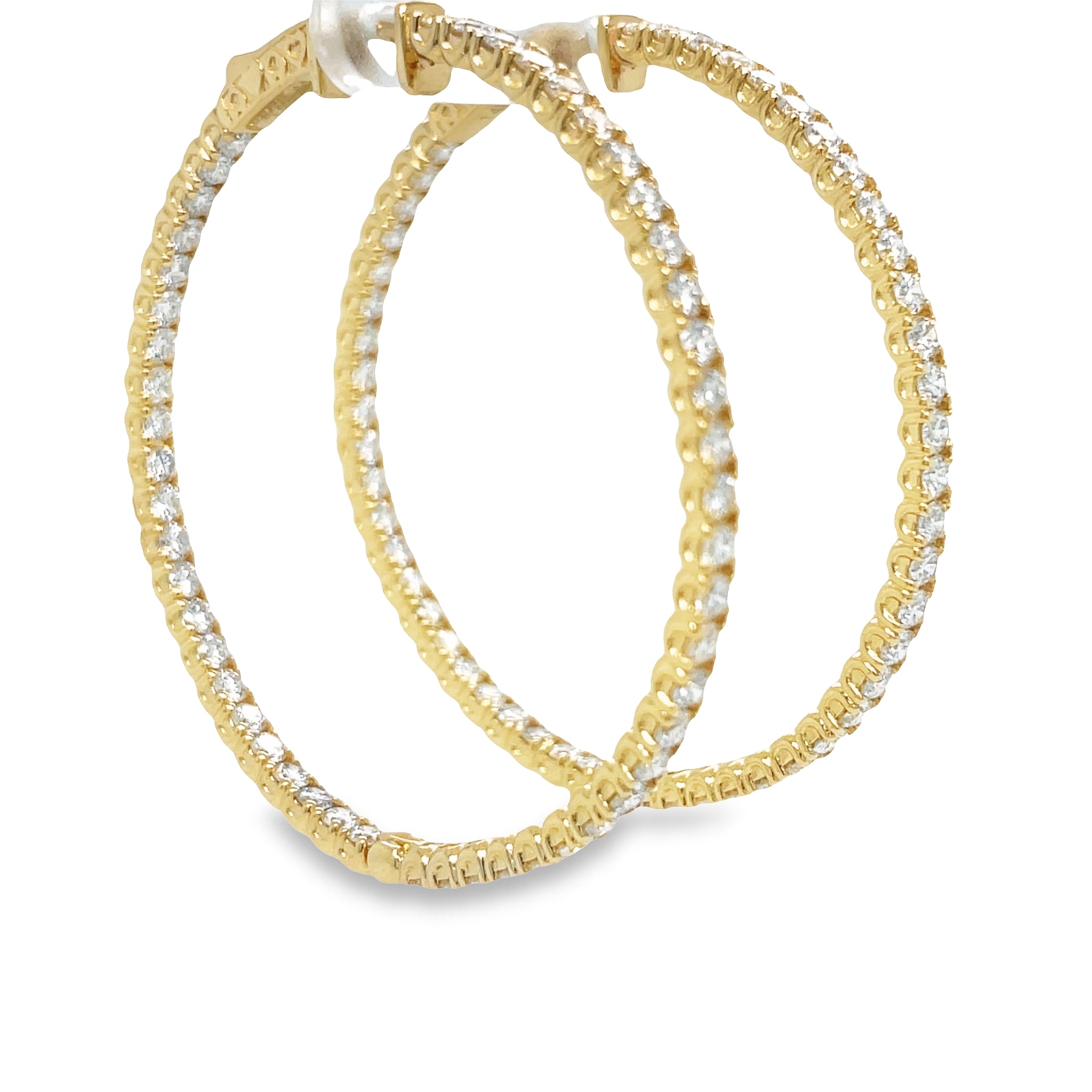 These Large Hoop Earrings feature 5.25 ct Round diamonds of F/G color and VS1 clarity. The hoops are 3.00 mm thick and 2" long, crafted from 14k yellow gold with a secure lock clasp. Lever back system ensures the earrings are easy to put on and take off.