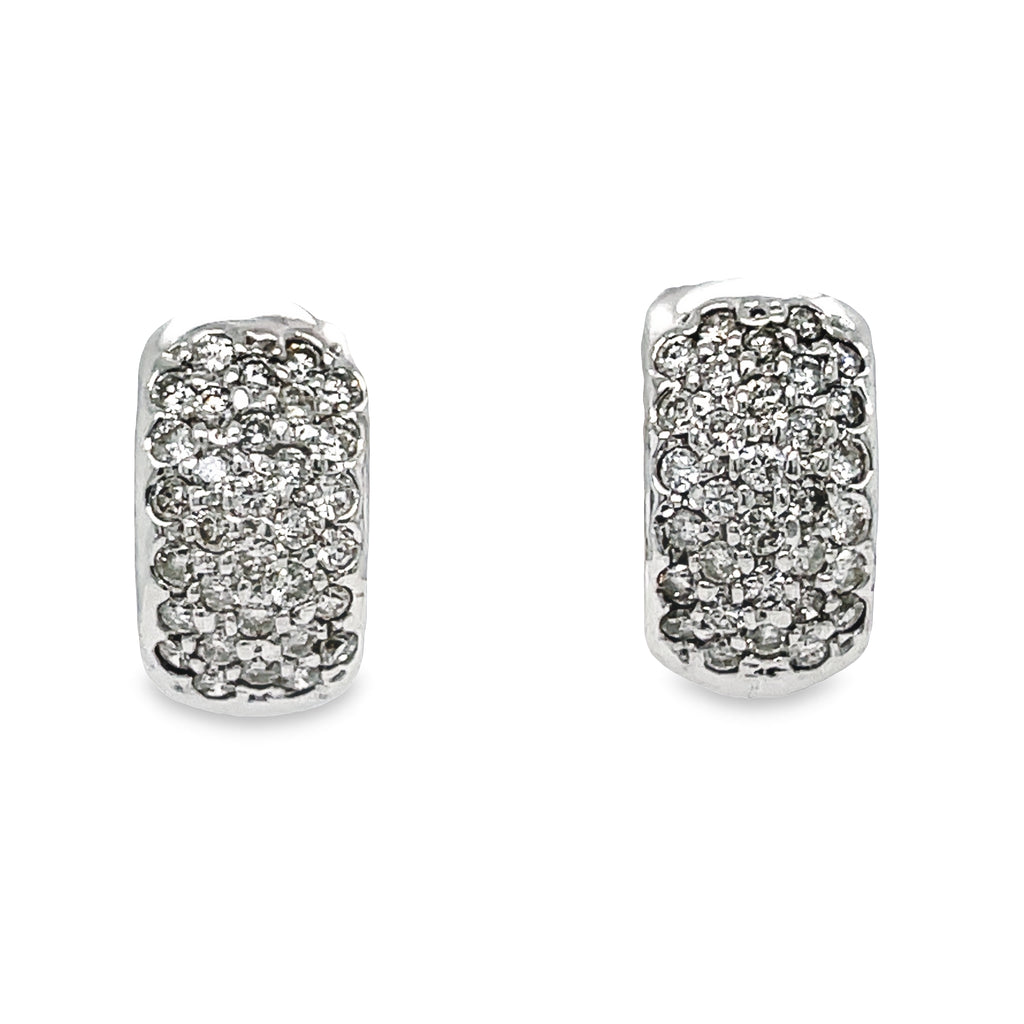 Add a touch of glamour to any outfit with our Pave Set Diamond Hoop Earrings! Made with 18k white gold and featuring a stunning diamond pave set totaling 1.40 cts, these earrings are the perfect choice for any stylish and elegant woman. The omega clip system ensures a secure and comfortable fit with every wear. Elevate your look and indulge in luxury with these exquisite earrings!