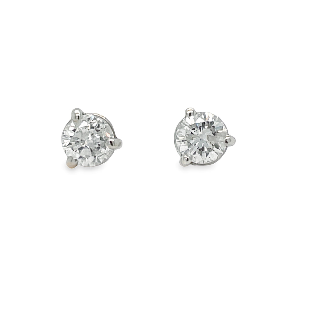 Indulge in elegance with our Diamond Stud Earrings. Crafted in 14k white gold, these earrings feature a stunning 0.60 carat round diamond in a classic martini setting. Elevate any outfit with the timeless beauty and sophistication of these earrings.