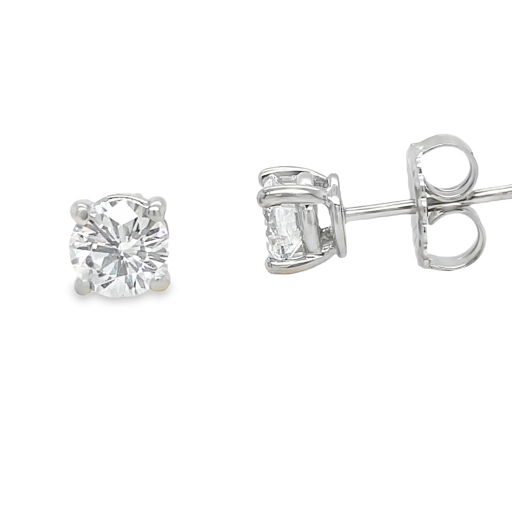 Elevate your style with our exquisite Diamond Stud Earrings! Crafted with two round brilliant diamonds, basket set in sleek 14k white gold, these earrings exude timeless elegance. Showcasing H color and VVS clarity, they're the perfect addition to any jewelry collection. Order now and shine bright like a diamond!