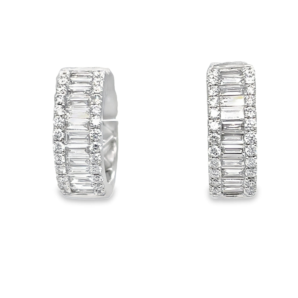 These dazzling hoop earrings are handcrafted with high quality diamonds in 18k white gold. With a total of 1.27 carats of sparkling round and baguette diamonds in a stunning F/G color and VS1 clarity, they make a secure and stylish addition to any jewelry collection.