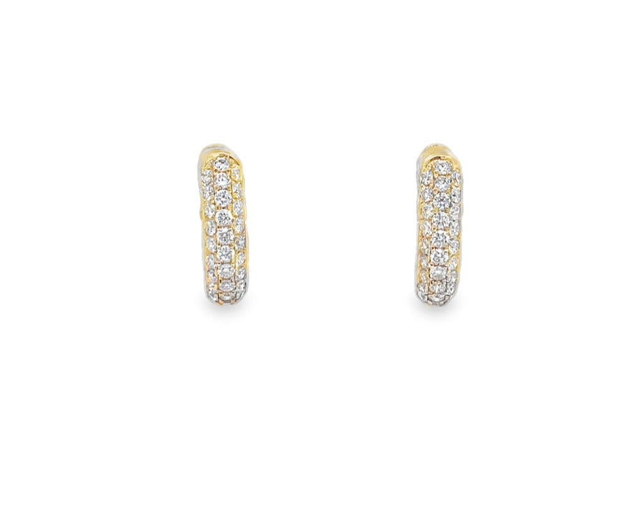 Elevate your style with our 18K Diamond Huggie Earrings. Crafted in 18k yellow gold, these earrings feature a stunning array of round pave diamonds, totaling 0.47 cts. The 13.00 mm size and hinged system make them easy to wear and the perfect addition to any outfit. Experience the luxury of sophisticated elegance with these earrings.