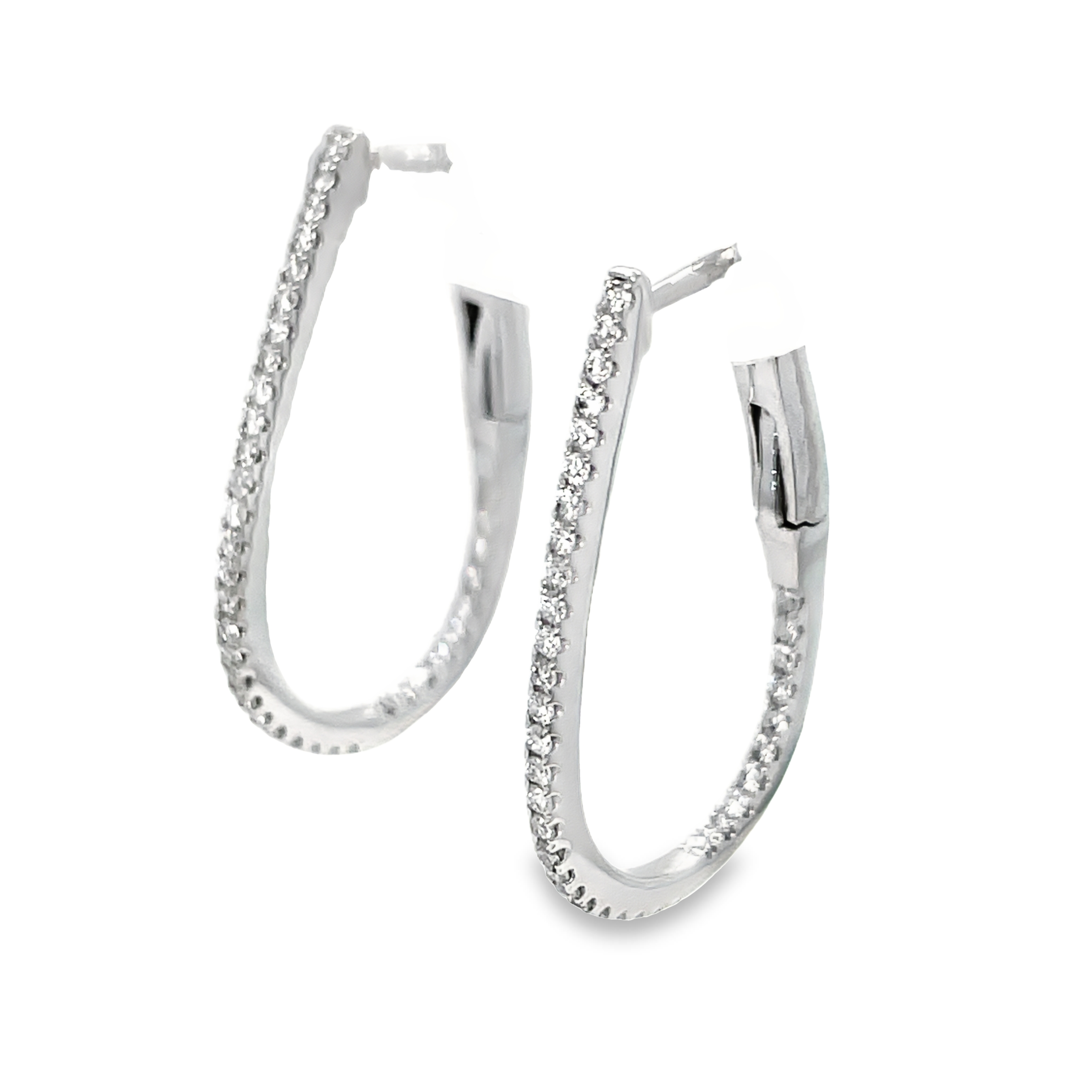 Crafted with 18k white gold, these oval-shaped diamond hoop earrings feature a secure hinged system. Adorned with round diamonds totaling 0.39 carats, these earrings add a touch of sparkle and elegance to any outfit. Trust in the expert design for a timeless and secure accessory. 1" size&nbsp;