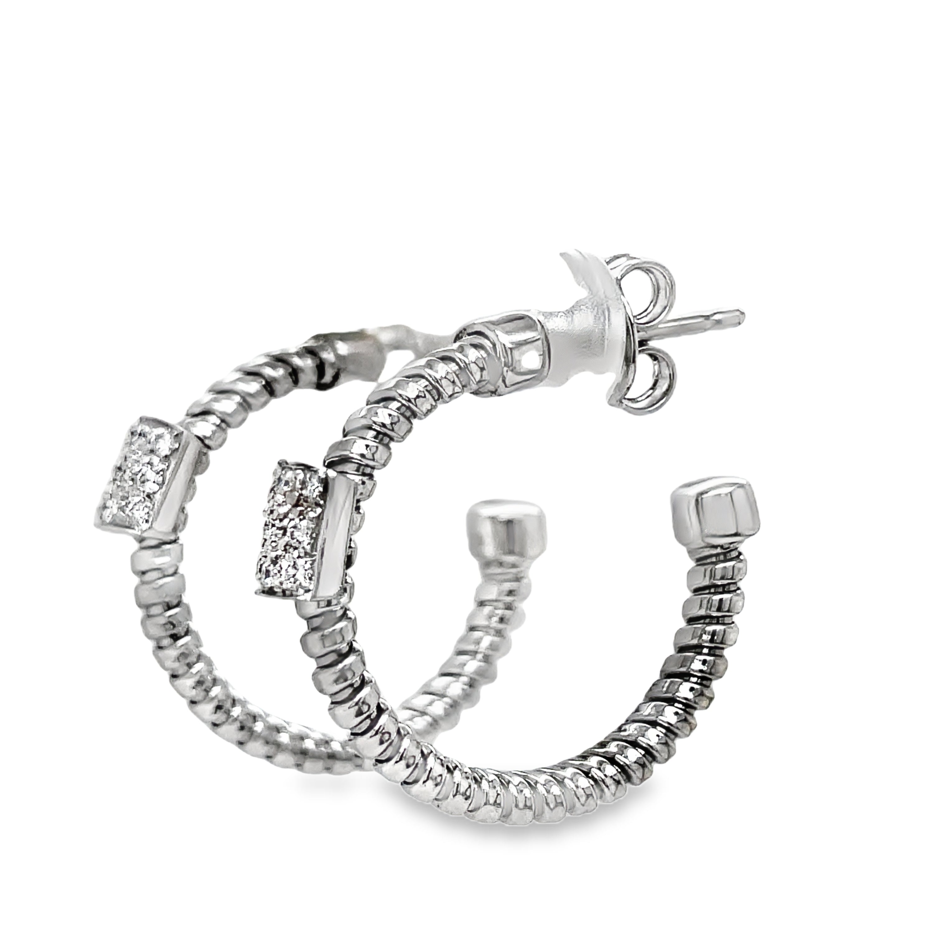 Indulge in luxury with our Italian made,18K white gold hoop earrings. Meticulously crafted by Novecentonovantanove, these exquisite earrings feature 0.18 carats of round diamonds and secure friction backs for added convenience. Elevate your style with this elegant and exclusive accessory. 3/4 " size&nbsp;