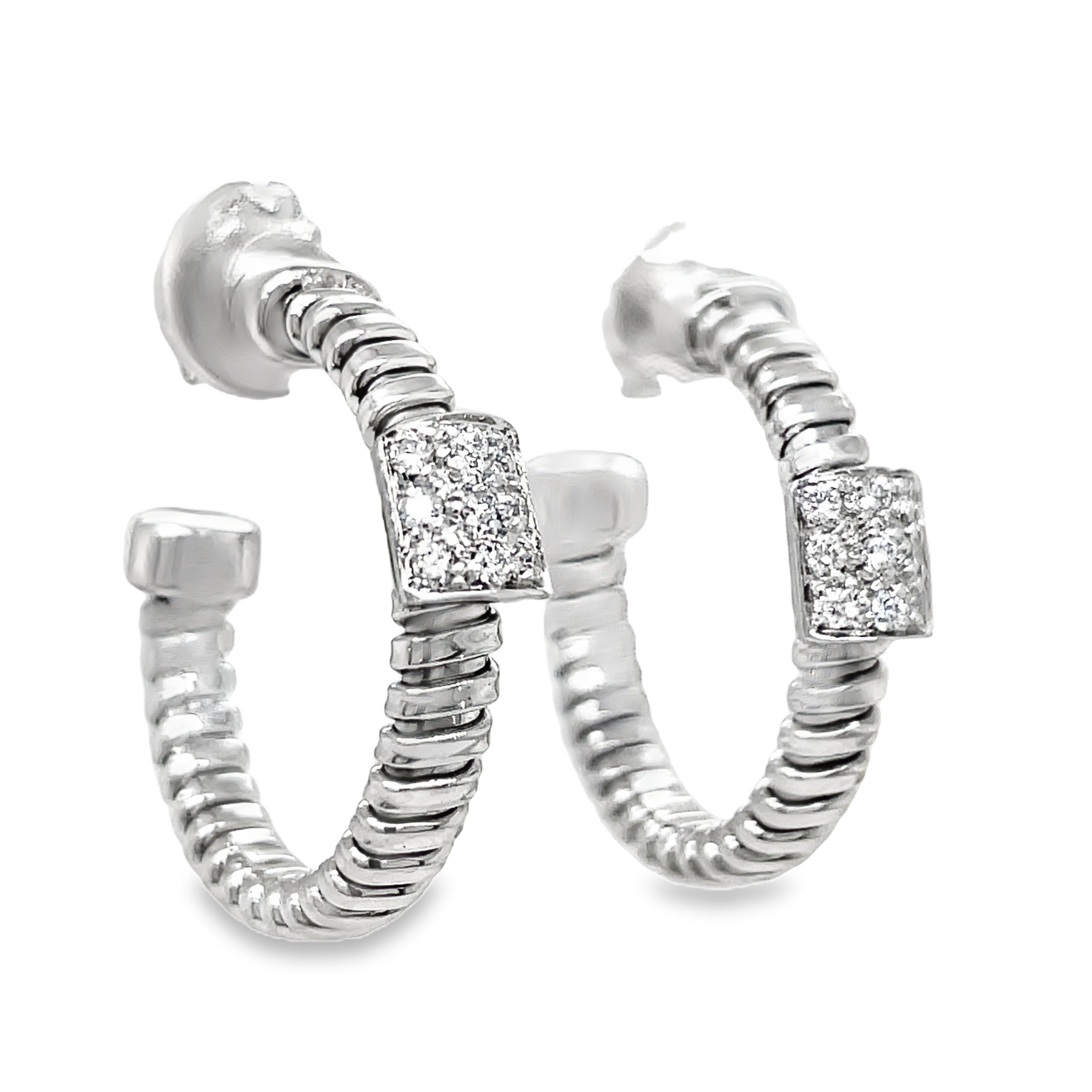 Indulge in luxury with our Italian made,18K white gold hoop earrings. Meticulously crafted by Novecentonovantanove, these exquisite earrings feature 0.18 carats of round diamonds and secure friction backs for added convenience. Elevate your style with this elegant and exclusive accessory. 3/4 " size&nbsp;