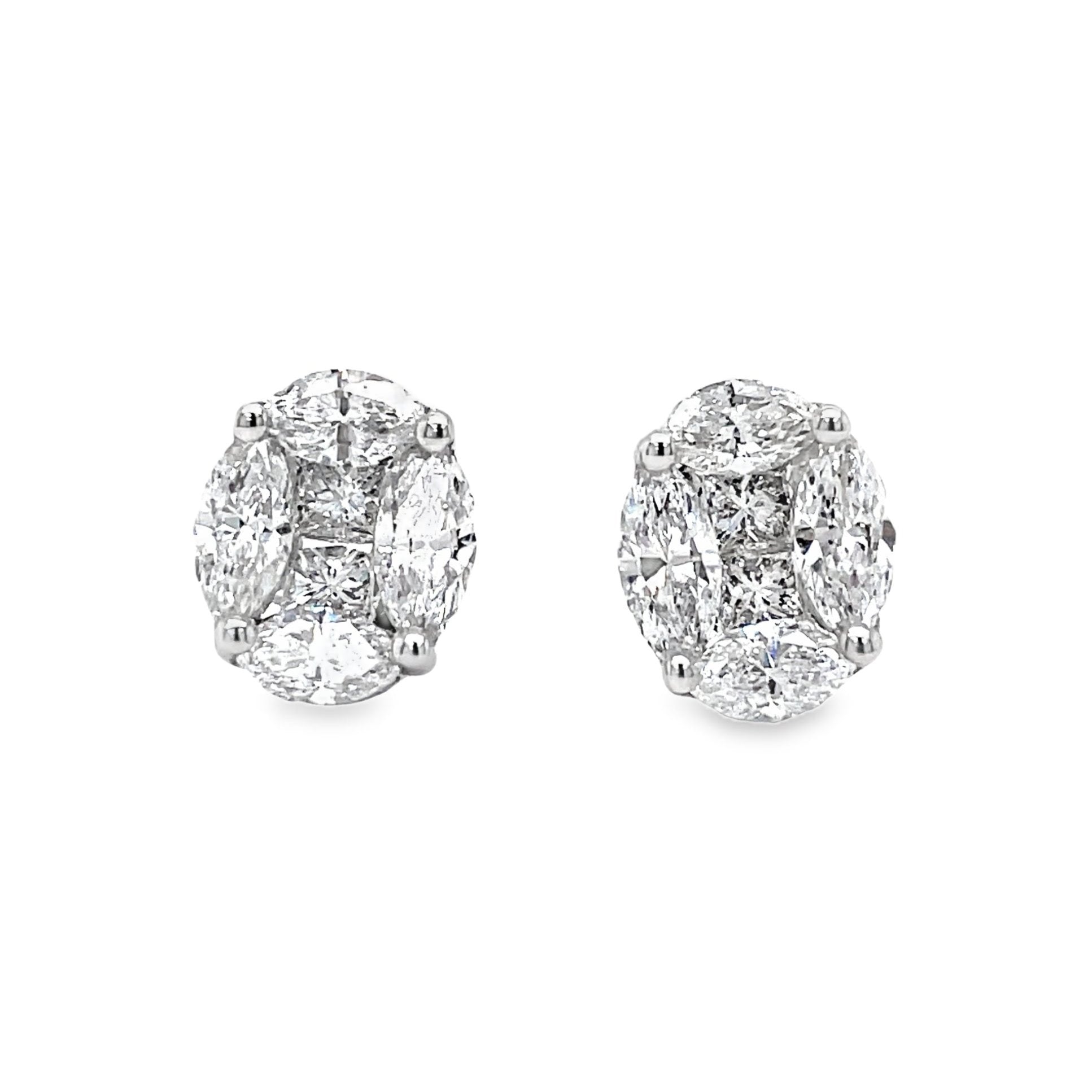 ndulge in pure luxury with our Oval Shape Illusion Diamond Stud Earrings. Expertly crafted with high-quality diamonds set in 18k white gold, these earrings feature a mix of fancy cut diamonds for a stunning 1.26 carat display. With a beautiful F/G color and VS1 clarity, these earrings will give you the elegant illusion of wearing 1.50 carat studs. Complete with secure friction backs, measuring at 8.50 x7.00 mm wide. Elevate your style with these exquisitely made earrings.