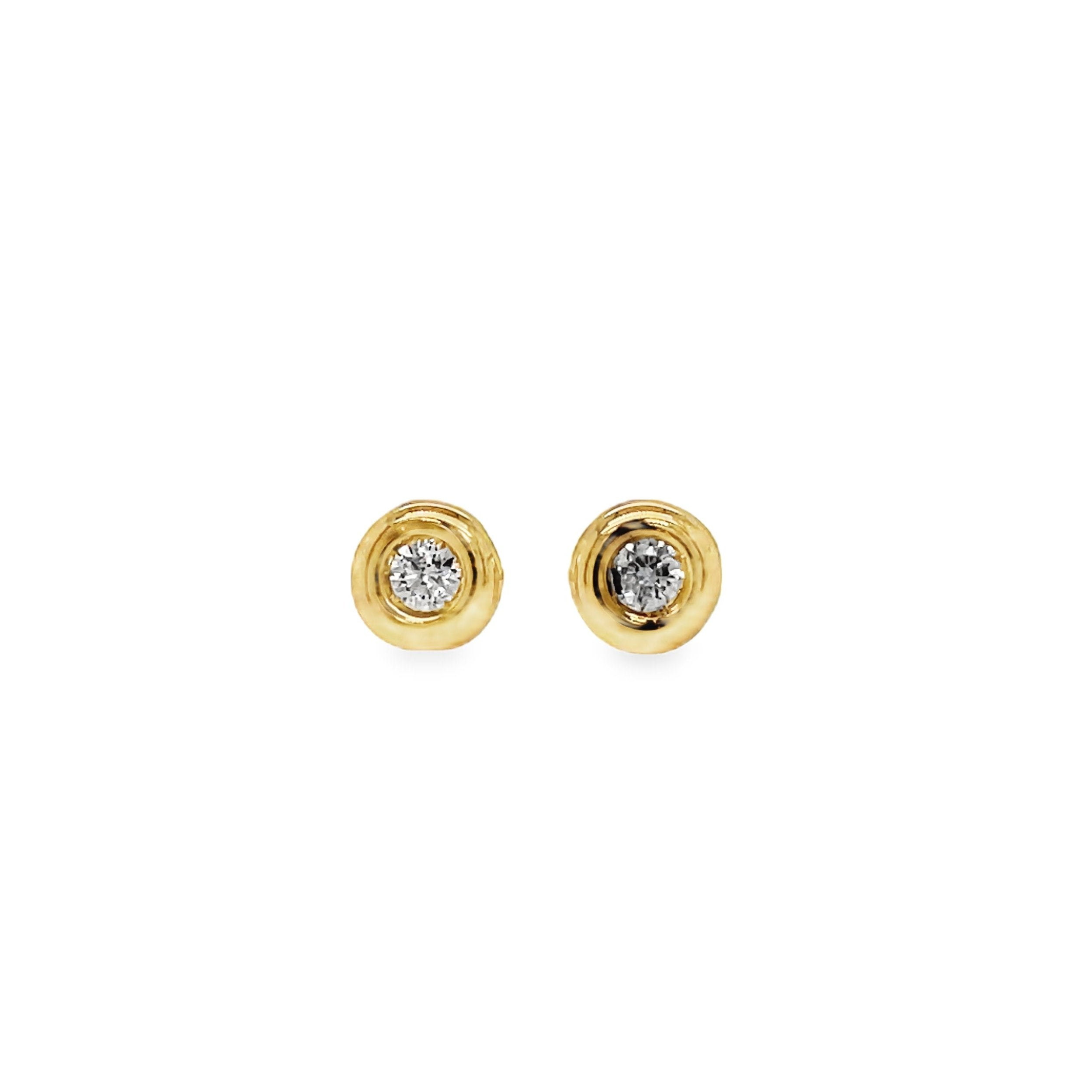 Elevate your style with our Diamond Stud Earrings. Crafted in 18k yellow gold, these dainty earrings feature 2 small diamonds totaling 0.06 carats, set in a secure bezel. With heart-shaped friction backs, they offer both elegance and secure wear. At 4.50 mm long, these earrings make a subtle yet luxurious statement.