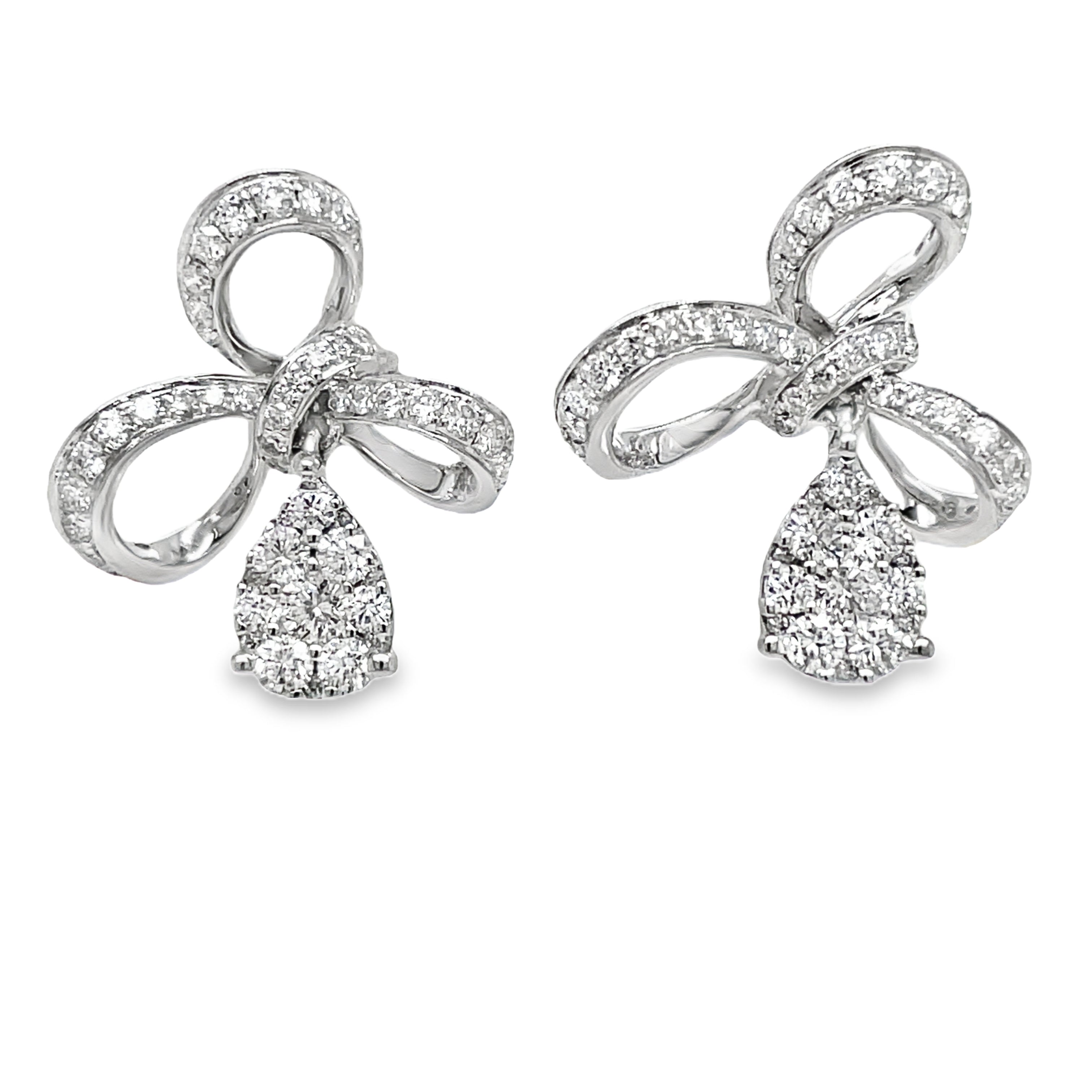 Indulge in pure elegance with our 18K Stunning Diamond Bow Drop Earrings. Crafted from 18k white gold, these earrings feature a delicate bow design adorned with sparkling round diamonds totaling 1.01 ct. Perfect for adding a touch of sophistication and luxury to any outfit.