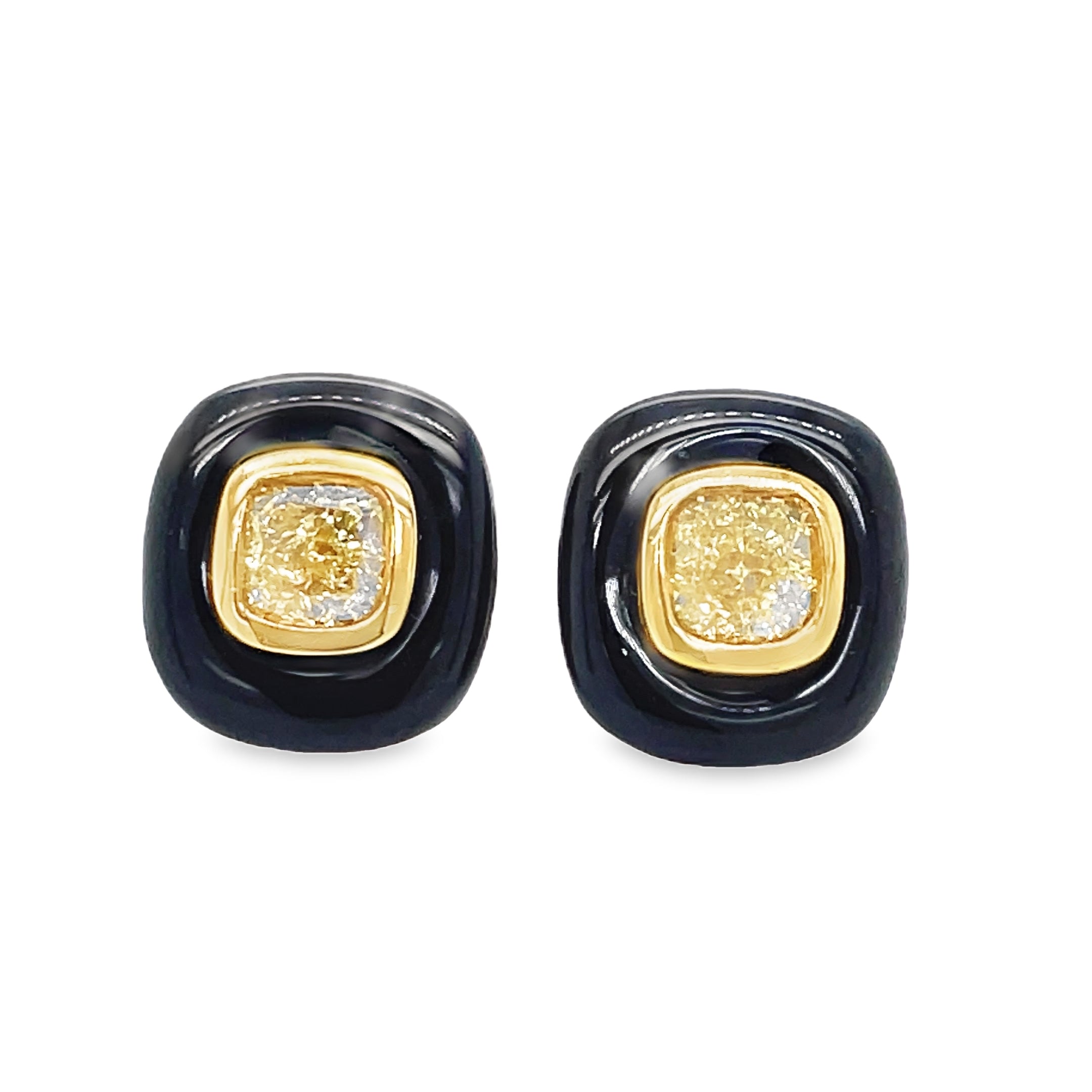 Indulge in luxury with our Fancy Yellow Diamond Stud Earrings, set in 8k yellow gold with a secure friction back. The striking 1.10 cts of fancy yellow diamonds are enhanced by the elegant cabochon onyx, making this a unique and sophisticated addition to your jewelry collection.