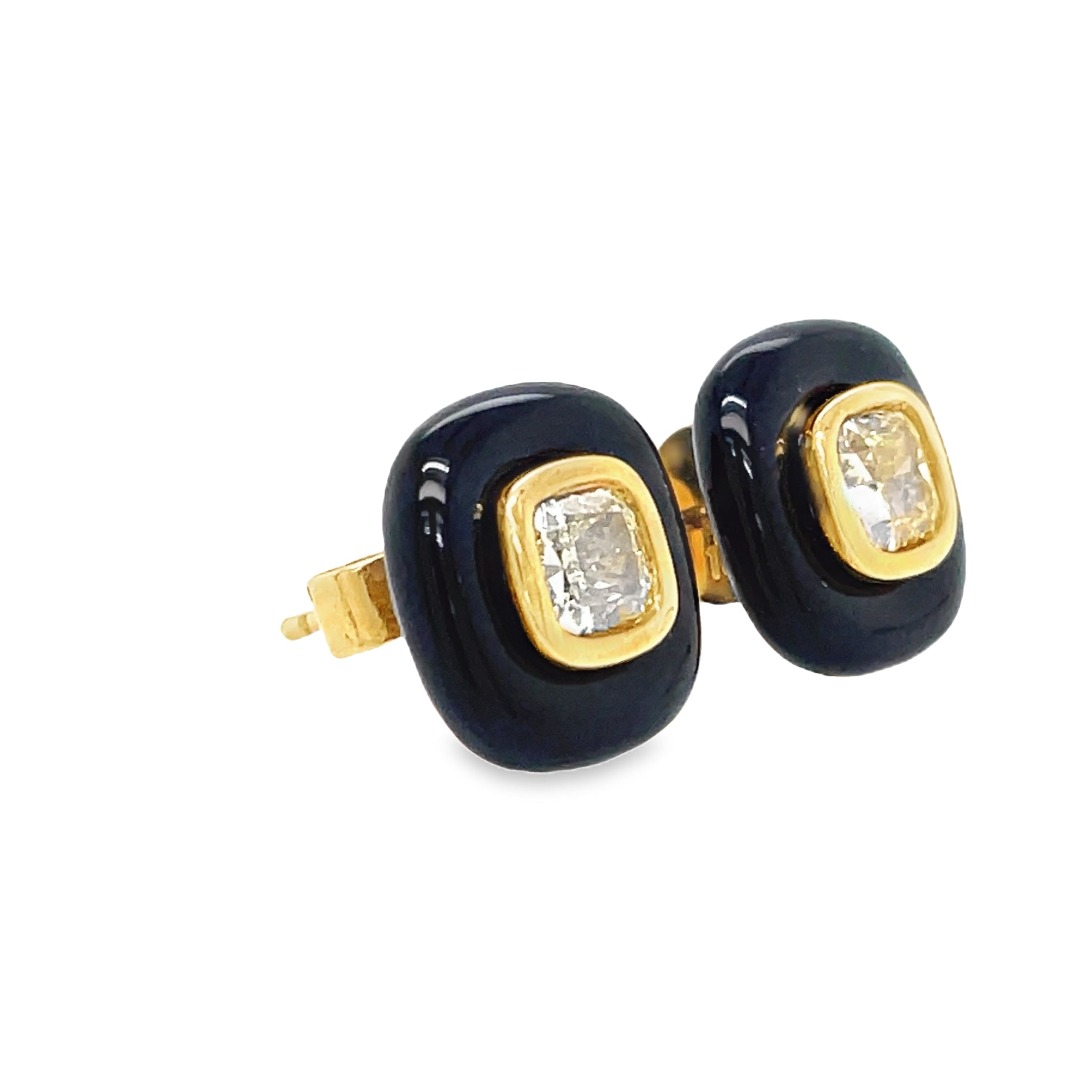 Indulge in luxury with our Fancy Yellow Diamond Stud Earrings, set in 8k yellow gold with a secure friction back. The striking 1.10 cts of fancy yellow diamonds are enhanced by the elegant cabochon onyx, making this a unique and sophisticated addition to your jewelry collection.