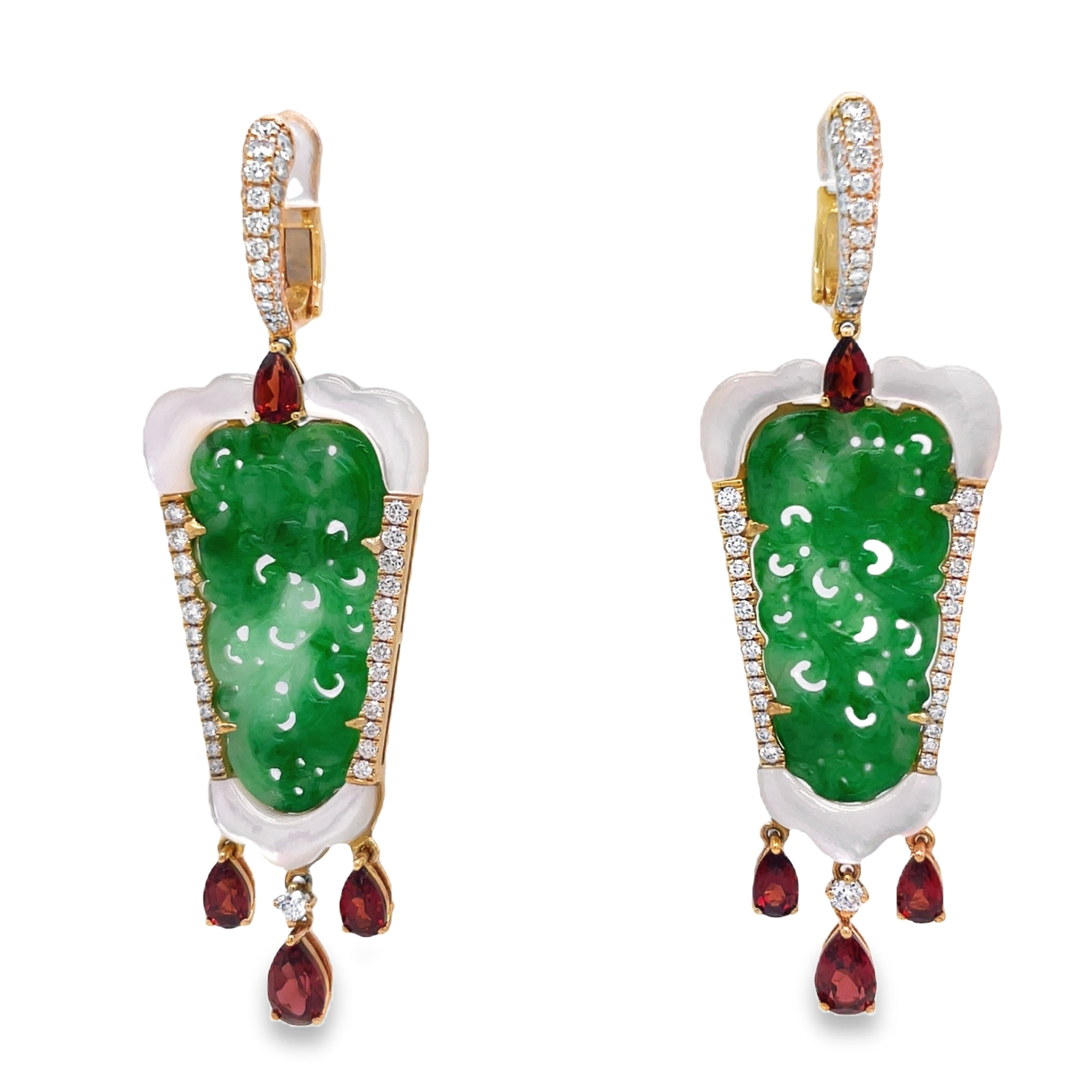 Elevate your style with these stunning green jade earrings hand carved with mother pearl and dazzling round diamonds. The dangling pear shape garnets add a touch of elegance to this 18k yellow gold design. With a secure huggie system, these earrings are 2.5" long. Own a piece of art that will make you stand out.