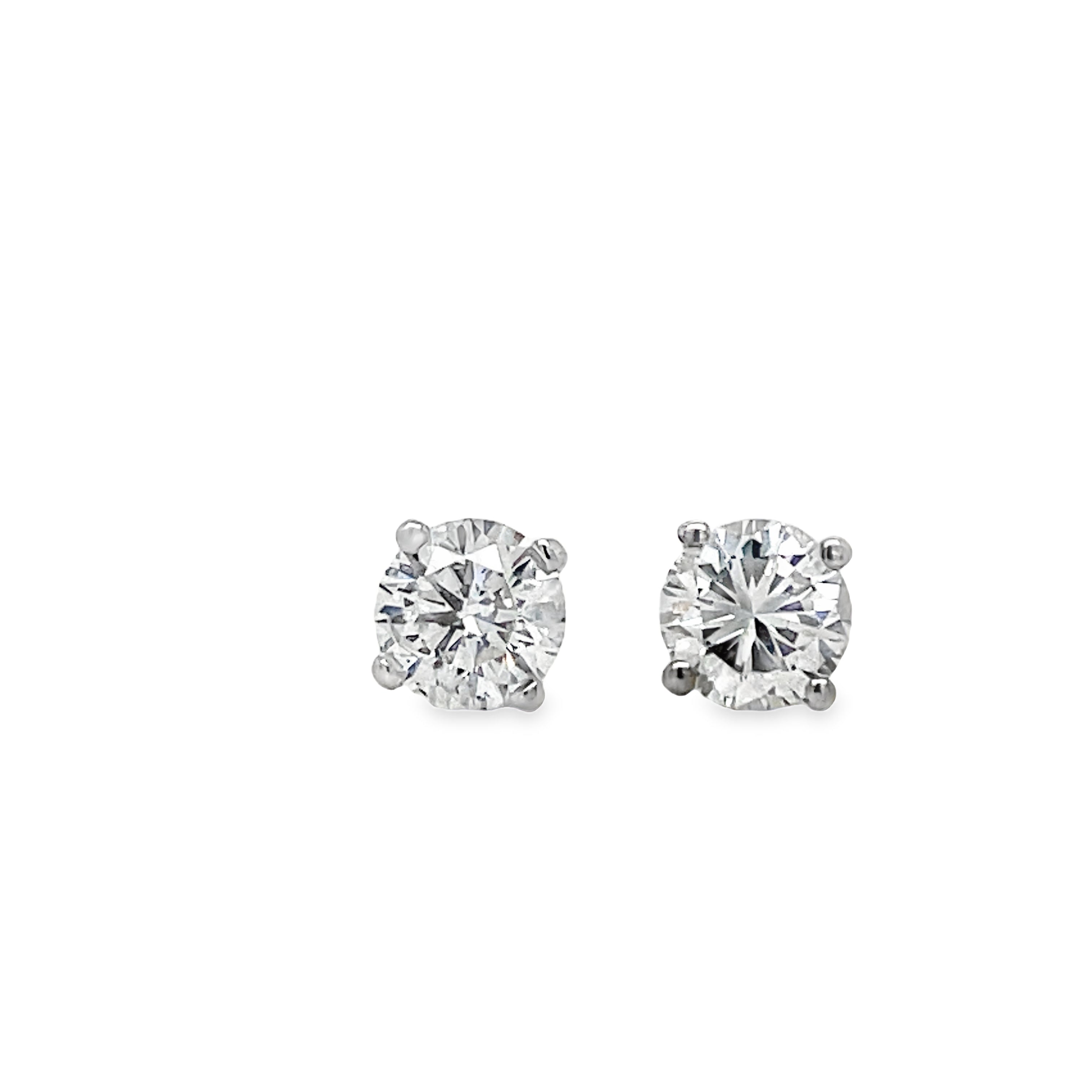 Elevate your style with these Diamond Studs adorned with 0.40 cts of round diamonds. Crafted in 14k yellow gold and featuring a secure screw back system, their brilliant F/G color and VS clarity will add a touch of sophistication to any outfit.