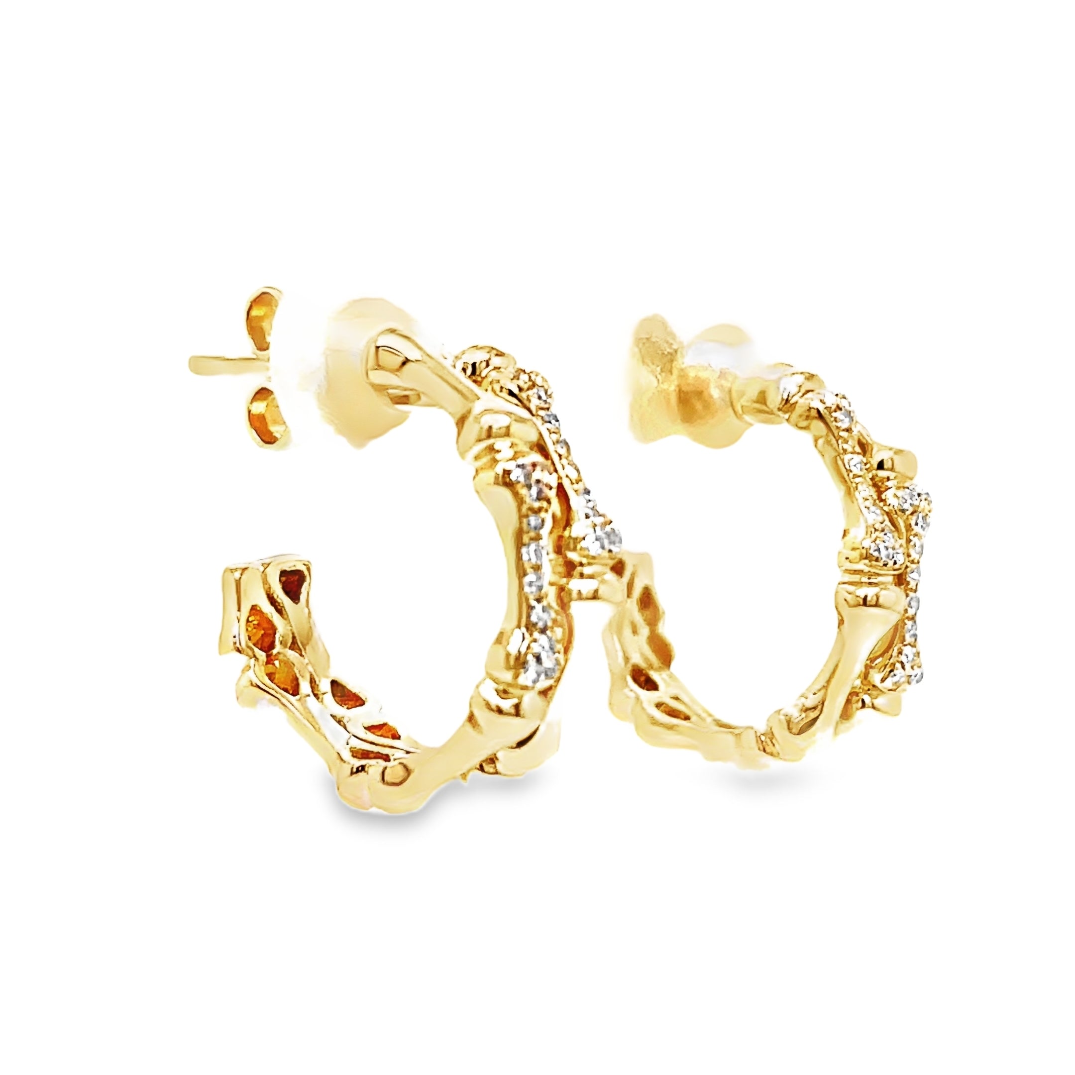 Indulge in luxury with our Diamond Bamboo Style Hoop Earrings. Crafted from 14k yellow gold, the bamboo style exudes elegance and the secure friction backs provide added peace of mind. Adorned with sparkling round diamonds, these earrings will elevate any outfit with their 0.09 cts of brilliance.