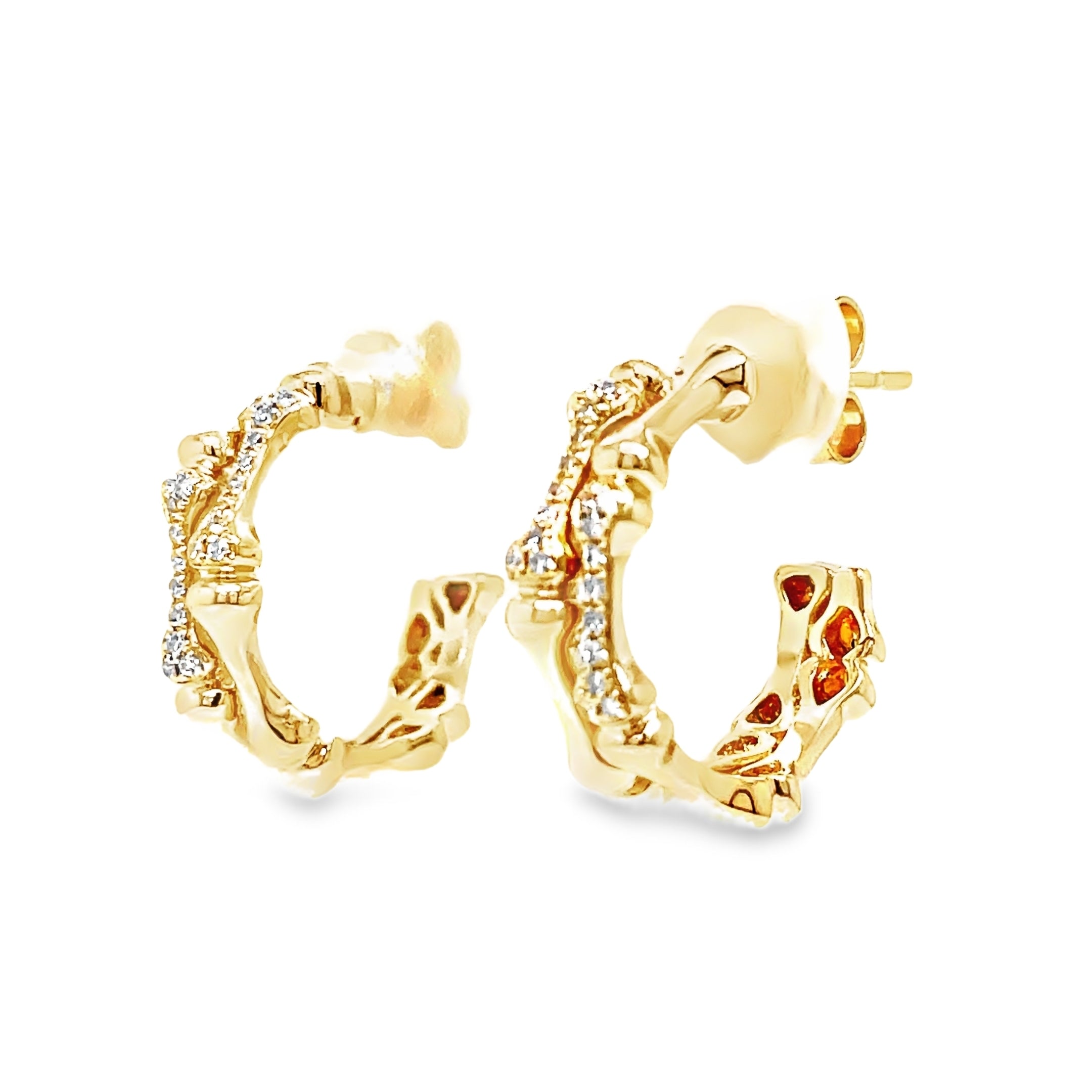 Indulge in luxury with our Diamond Bamboo Style Hoop Earrings. Crafted from 14k yellow gold, the bamboo style exudes elegance and the secure friction backs provide added peace of mind. Adorned with sparkling round diamonds, these earrings will elevate any outfit with their 0.09 cts of brilliance.