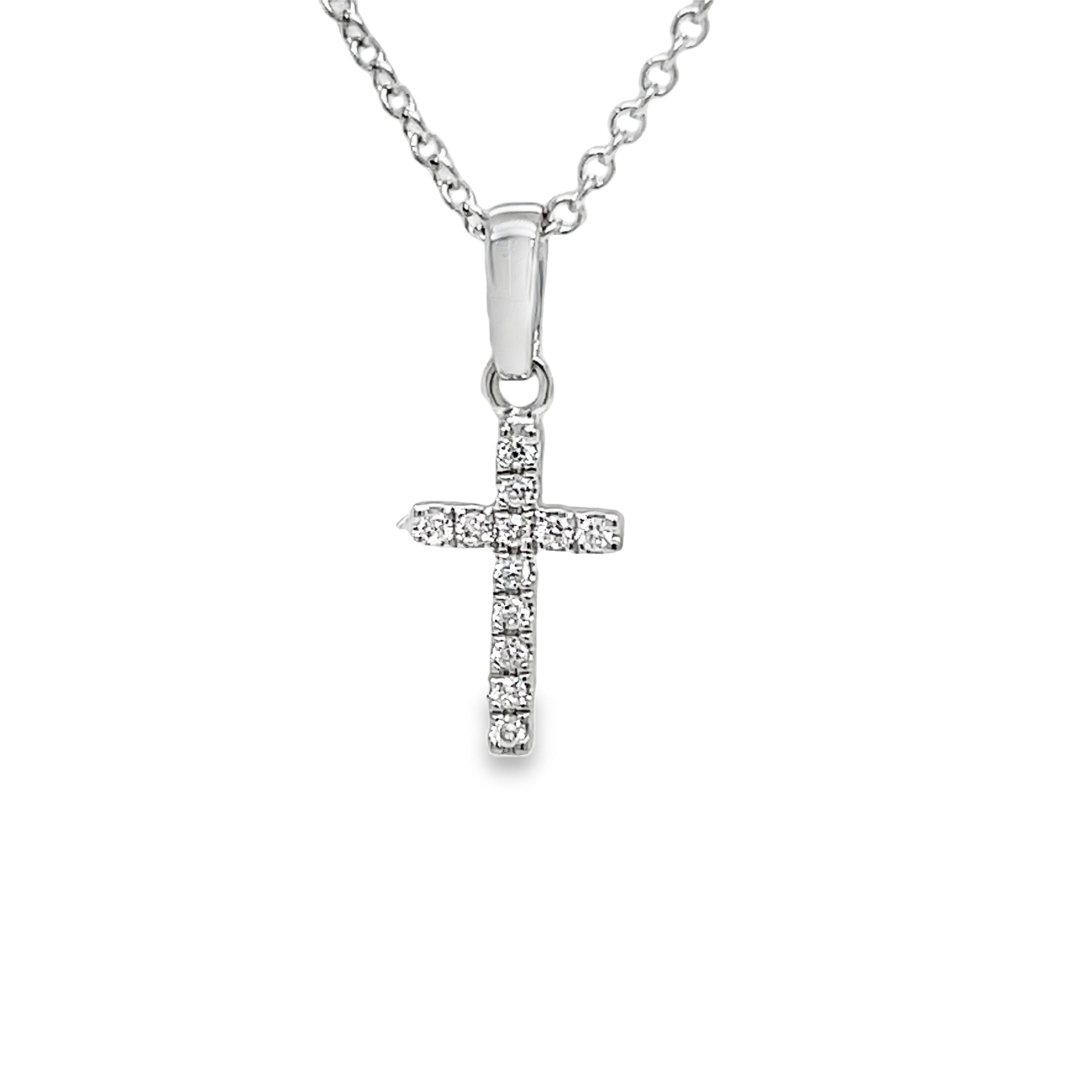 Elevate your style with our Small Diamond Cross Pendant Necklace. Crafted with precision in 18k white gold, this necklace features a beautiful round diamond totaling 0.04 carats. Measuring 12.00 mm, the pendant adds a touch of elegance to any outfit. Pendant only.