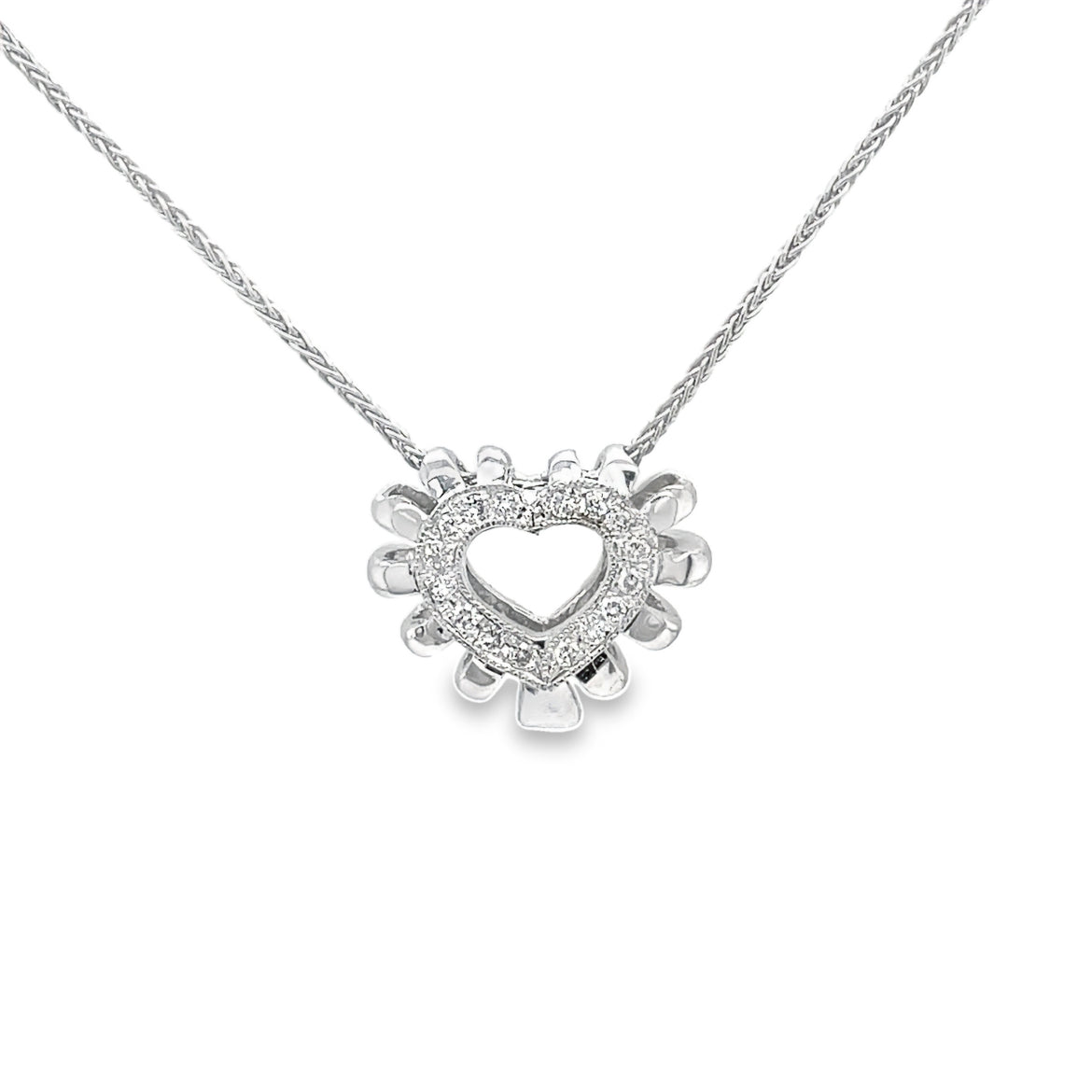 Update your jewelry collection with this exquisite and exclusive Heart Diamond Pendant Necklace. Crafted from 14k white gold, this necklace features a stunning heart-shaped pendant adorned with 0.50 cts of sparkling round diamonds. Complete with an 18' sturdy chain, this necklace is the epitome of sophistication and elegance. Elevate your look and exude luxury with this stunning piece.