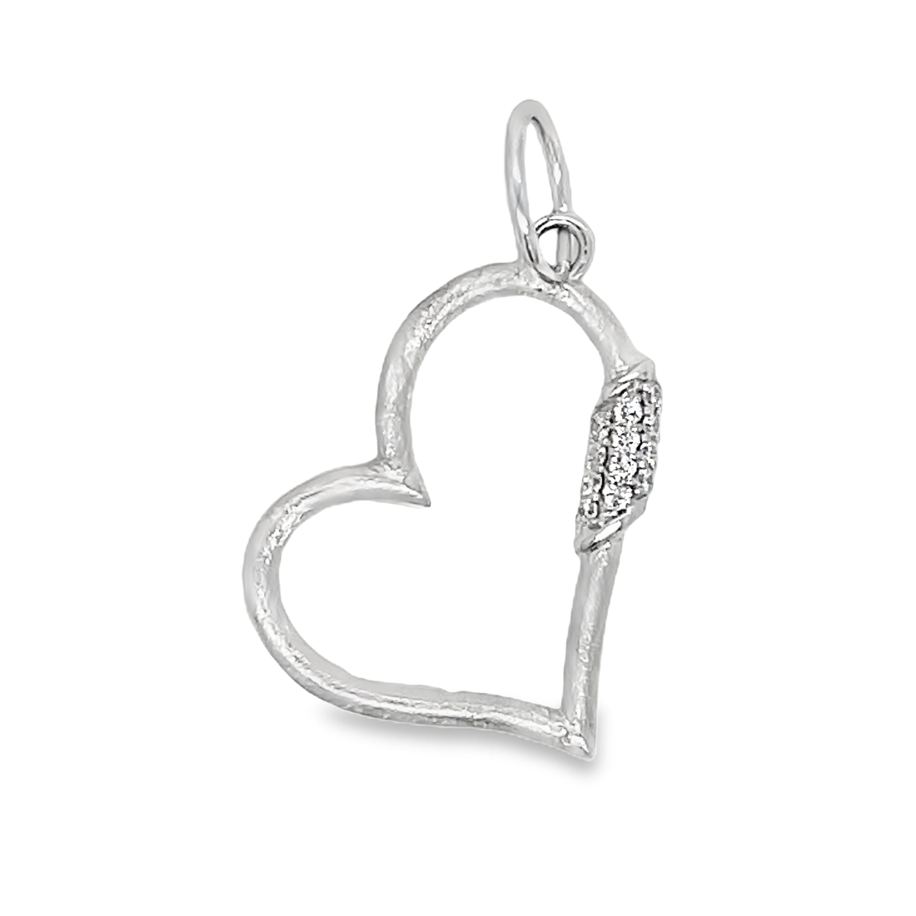 This 14k white gold heart pendant features intricate cutouts that add a touch of elegance to any outfit. Adorned with shimmering round diamonds, this pendant is the perfect accessory for those who appreciate sophisticated and exclusive jewelry. Embrace your inner luxury with this medium open heart pendant.