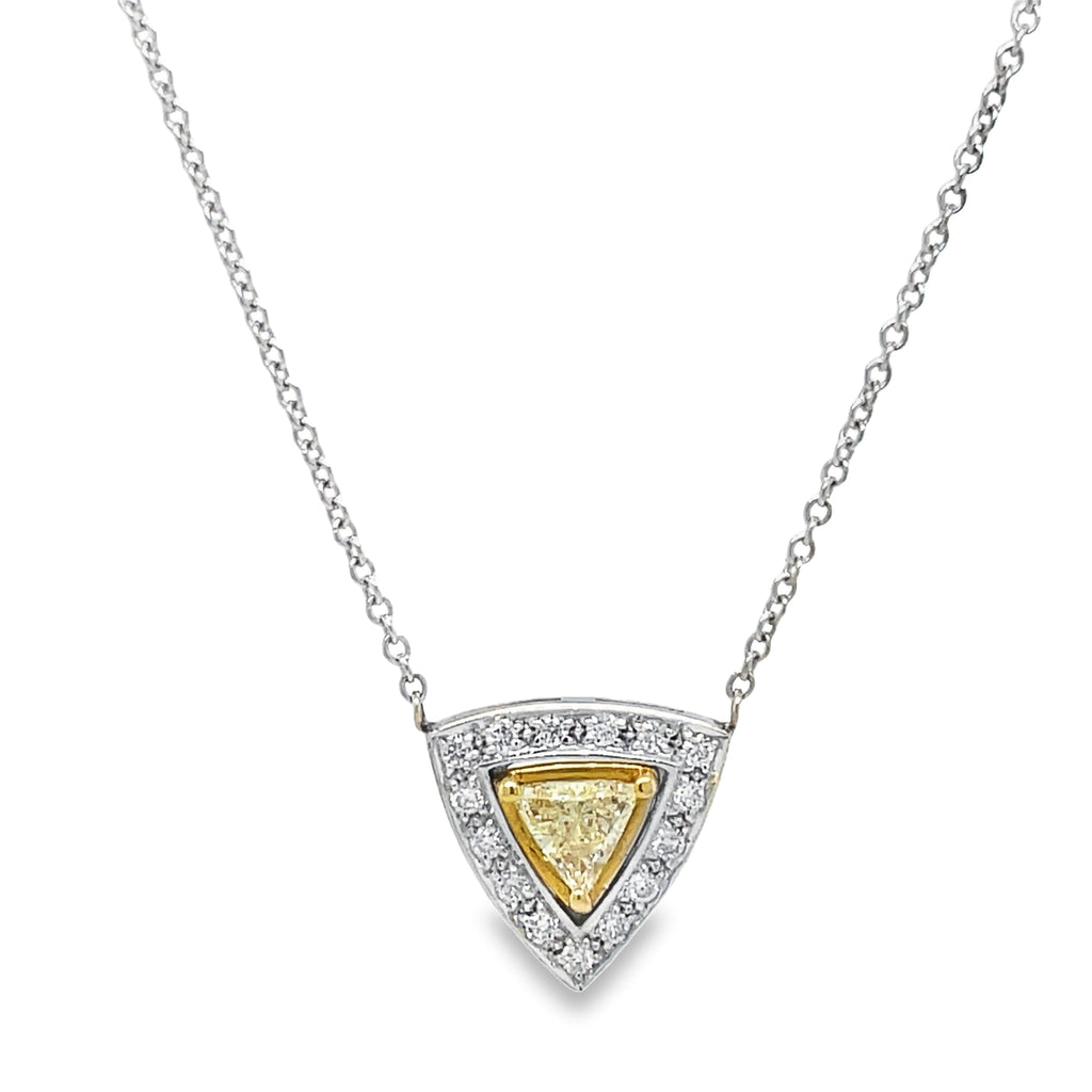 Elevate your style with our Fancy Yellow Diamond Trillion Pendant Necklace. With a stunning 0.52 carat trillion cut yellow diamond, surrounded by 0.96 carats of glittering round diamonds, and set in 18k white gold, this necklace radiates luxury. The 18" long chain adds the perfect touch of elegance. Make a statement and turn heads with this exquisite piece