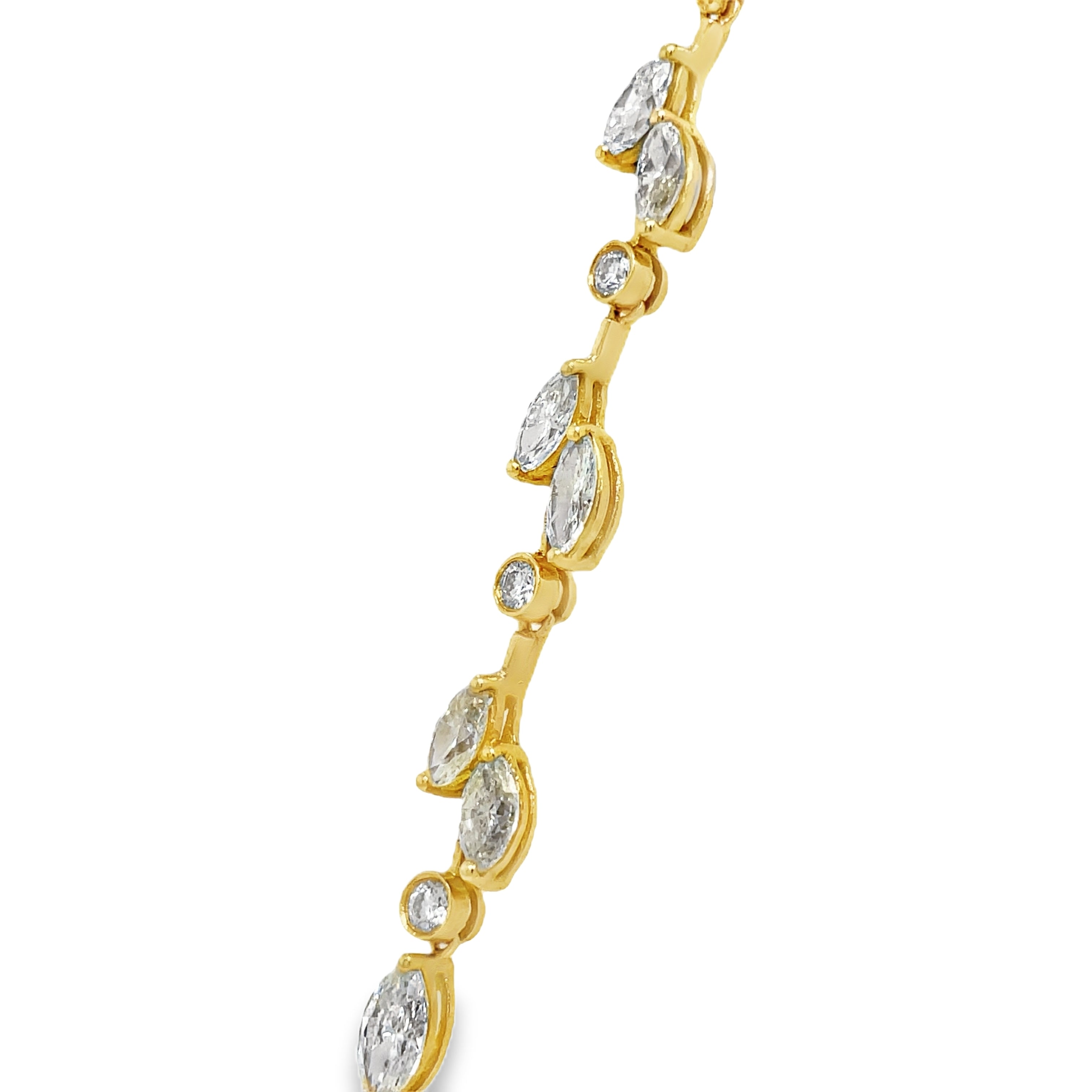 Indulge in the luxury of our Stunning Yellow Diamond Leaf Necklace. Handcrafted with 18k yellow and white gold, this exquisite necklace features 112 pear shape fancy yellow diamonds totaling 23.26 carats and 64 round white diamonds totaling 2.10 carats. With a secure figure 8 clasp, it radiates elegance and safety. At 17" in length, it's a true standout piece.